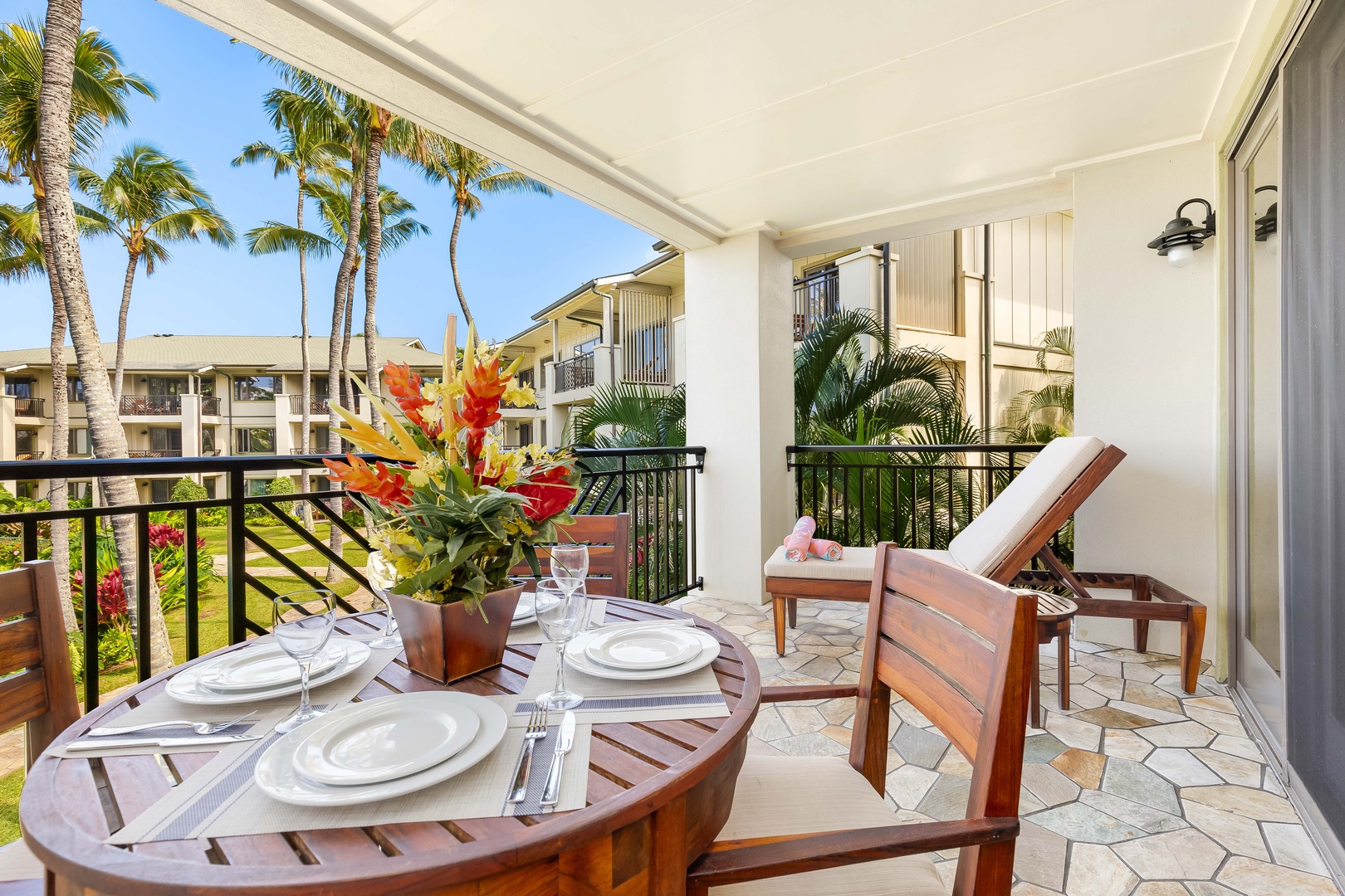 Kahuku Vacation Rentals, Turtle Bay Villas 209 - Elegant dining set and tropical views of swaying palms. Savor meals al fresco surrounded by paradise.