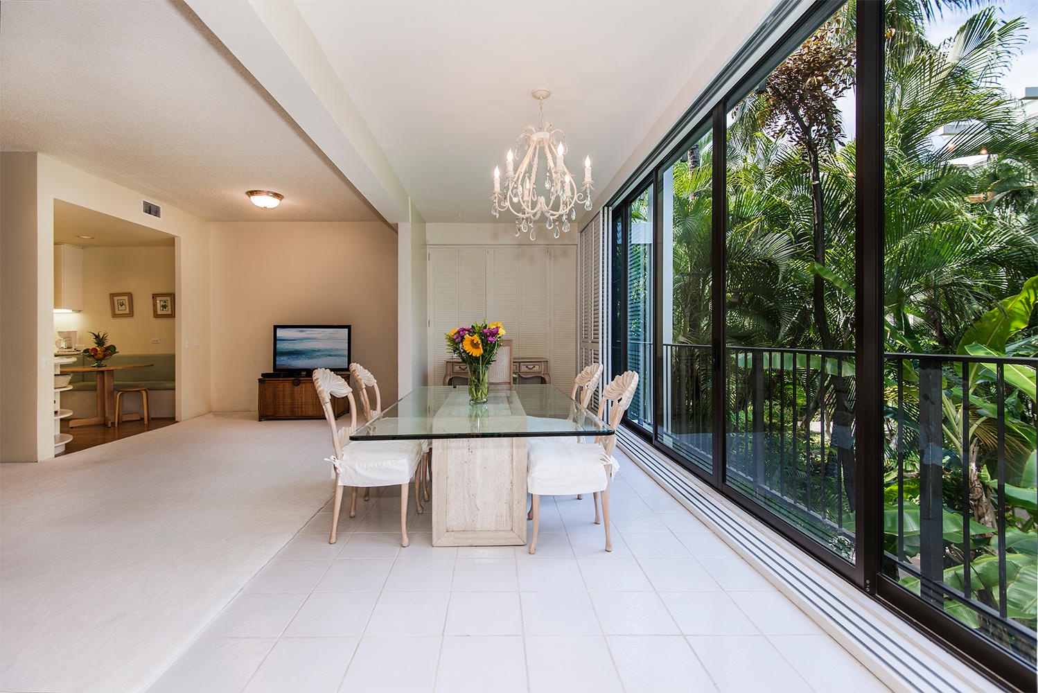 Honolulu Vacation Rentals, Kahala Beachfront Villa - Dine with a view in this bright and airy dining area with elegant table for four.