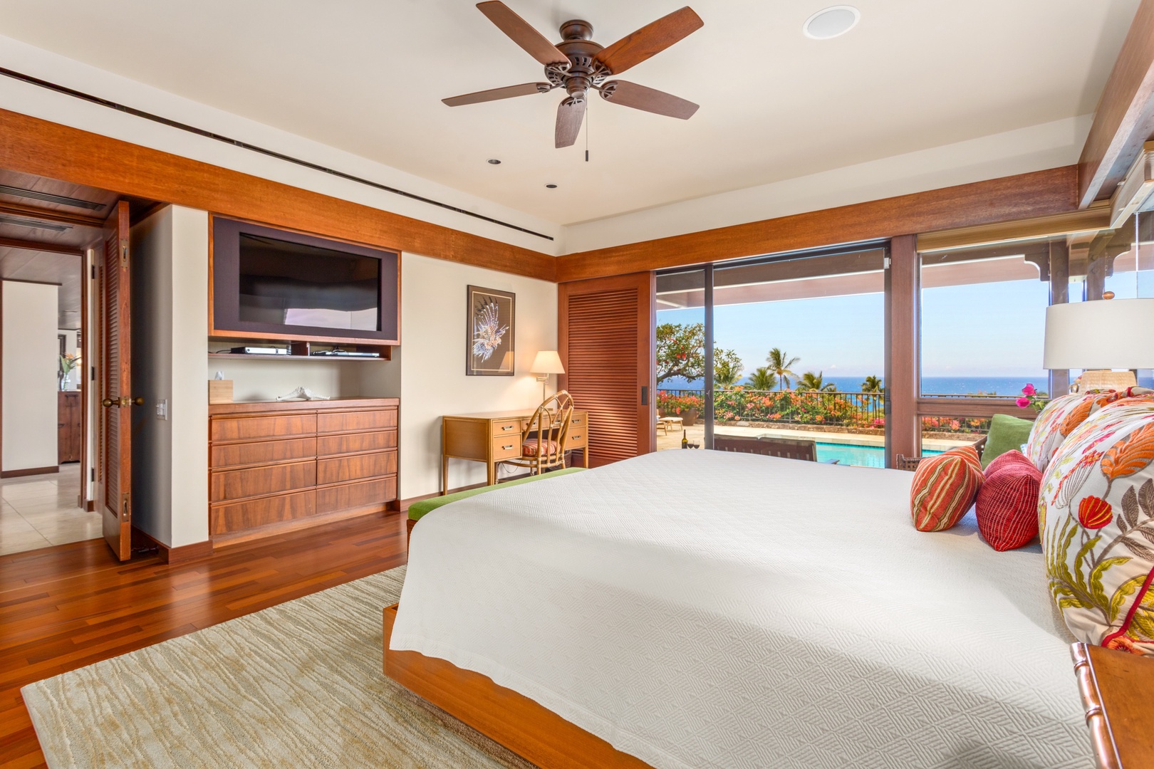Kamuela Vacation Rentals, 4BD Villas (21) at Mauna Kea Resort - View of Primary w/Flatscreen TV & View of Pool Deck & Ocean.