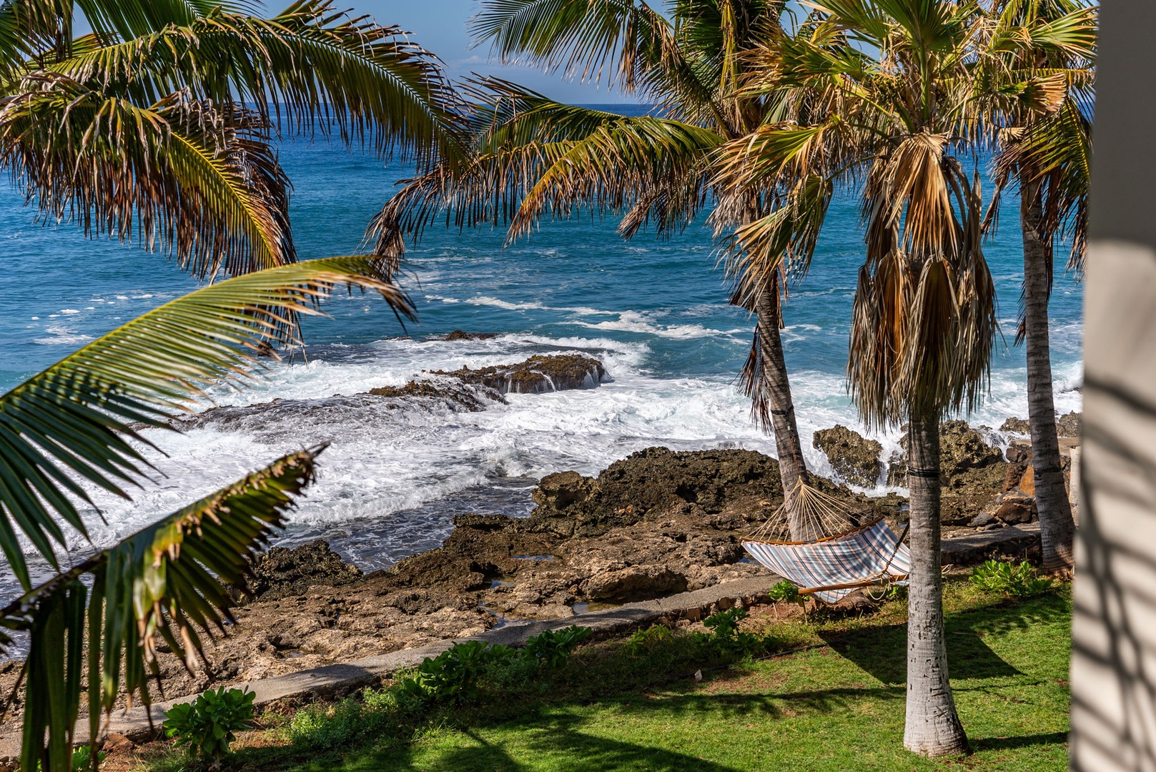 Waianae Vacation Rentals, Oceanfront Luxury Dream Estate - A hammock-ready shoreline bordered by palms—paradise within steps of your own private lanai.