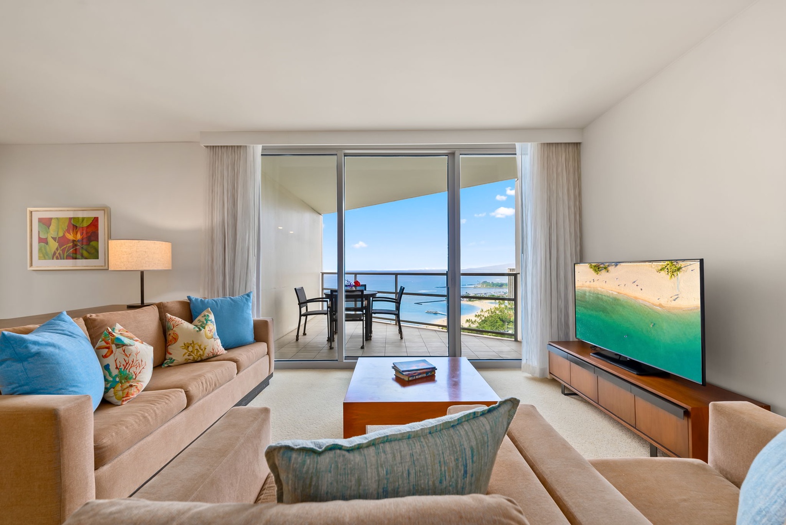 Honolulu Vacation Rentals, Kala'i 3203 - Relax in the cozy living room while enjoying stunning ocean views from the lanai.