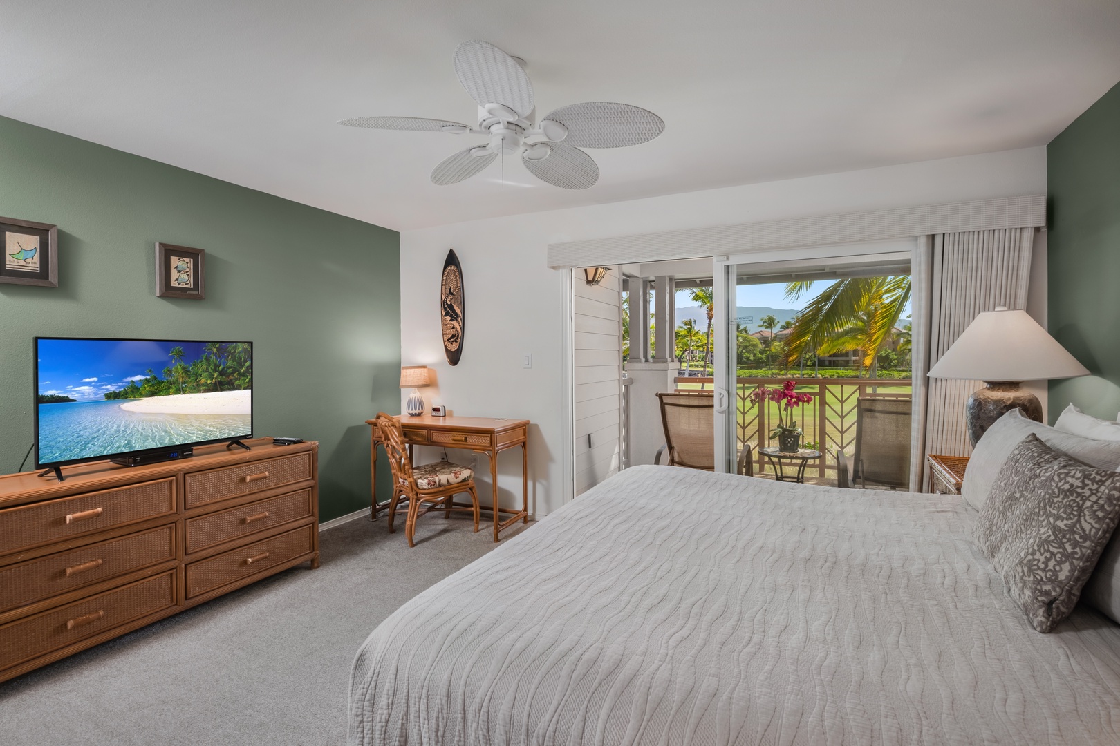 Waikoloa Vacation Rentals, Waikoloa Colony Villas 403 - Primary bedroom includes a flat-screen TV, dresser, and cozy desk nook—perfect for remote work or island planning.