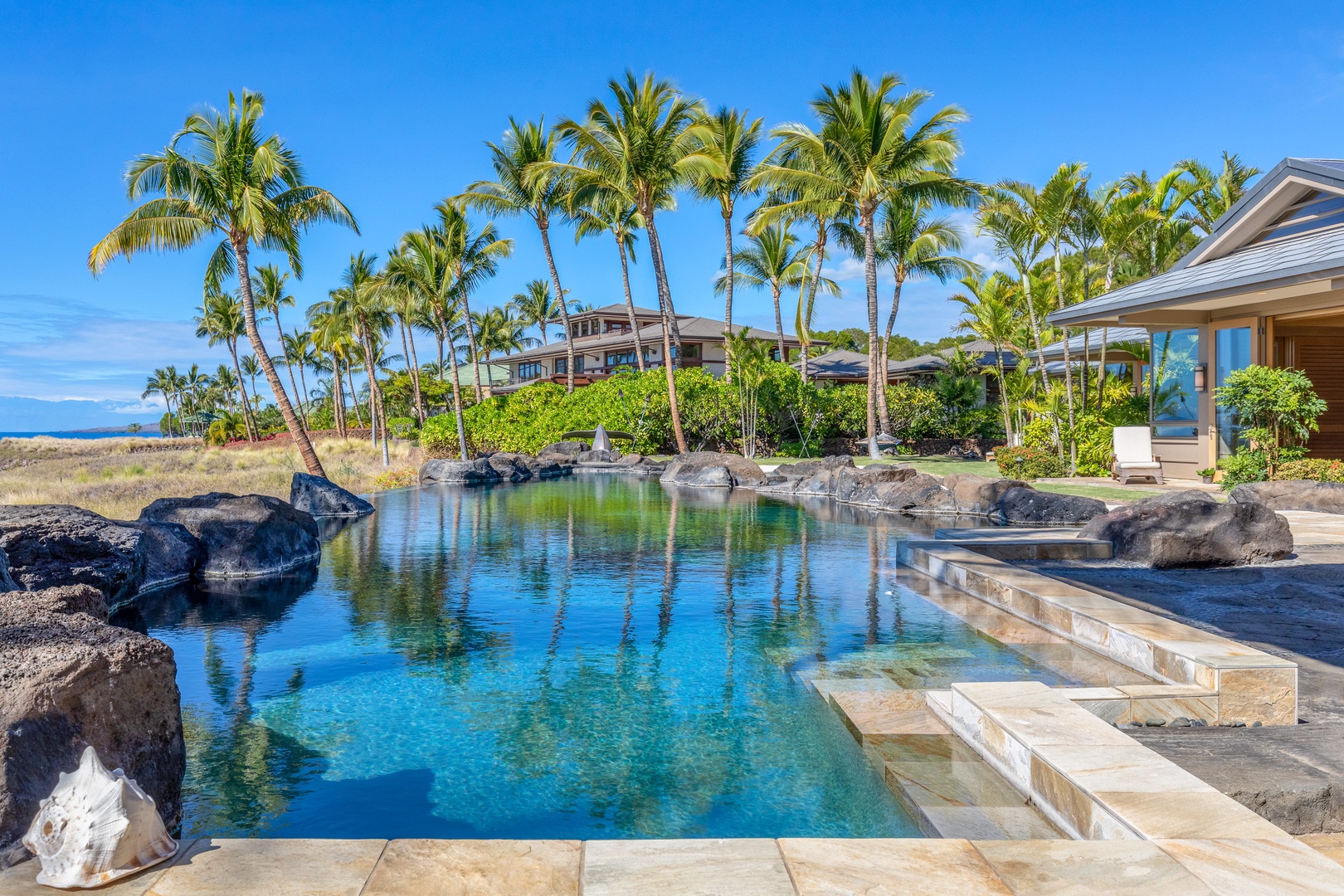 Kamuela Vacation Rentals, Mauna Kea Resort Bluffs 22 - The Beach House - An infinity-edge saltwater pool with swaying palms and crystal-clear water.