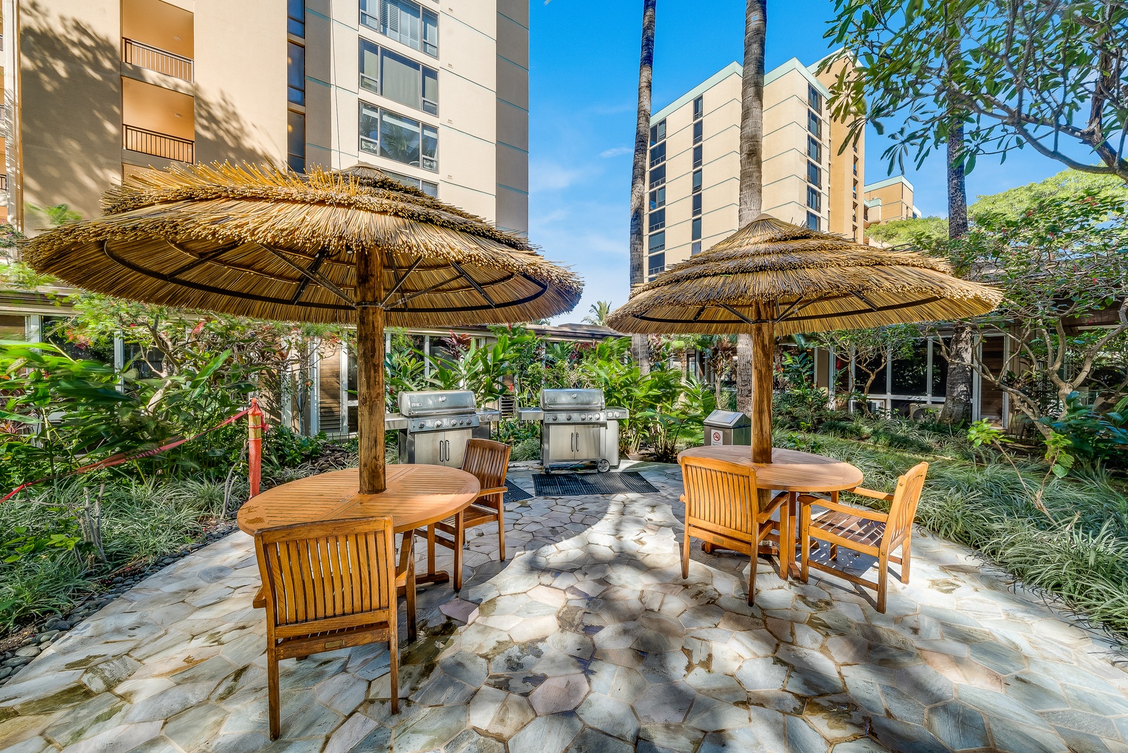 Lahaina Vacation Rentals, Mahana 1118 - Mahana 1118 offers a shared BBQ area with shaded seating for outdoor meals.