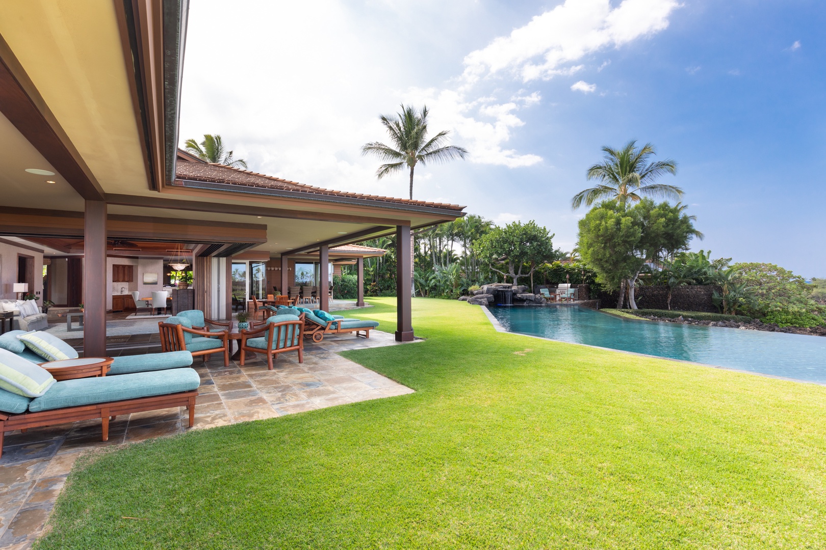 Kailua Kona Vacation Rentals, 5BD Ke Alaula Estate (144) at Hualalai Resort - Sprawling lawn space and shaded lanai, perfect for family fun or quiet relaxation.