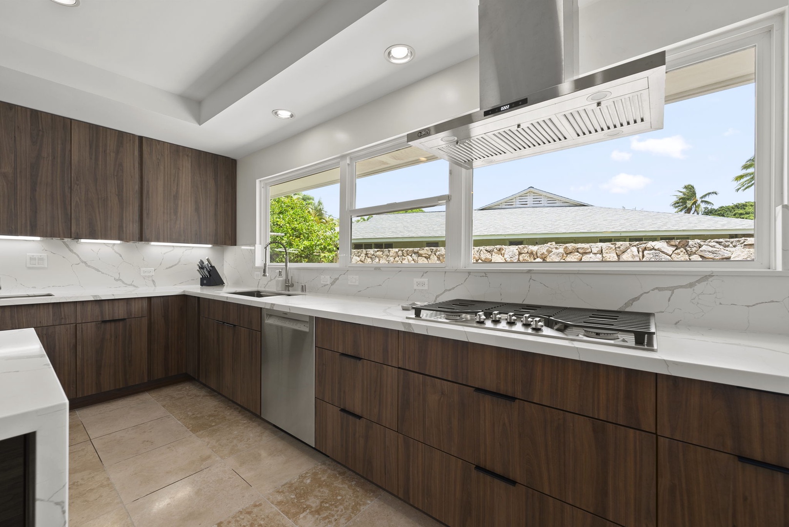 Honolulu Vacation Rentals, Kahala Lani - Bright kitchen with expansive counters and large windows that bring in island light.