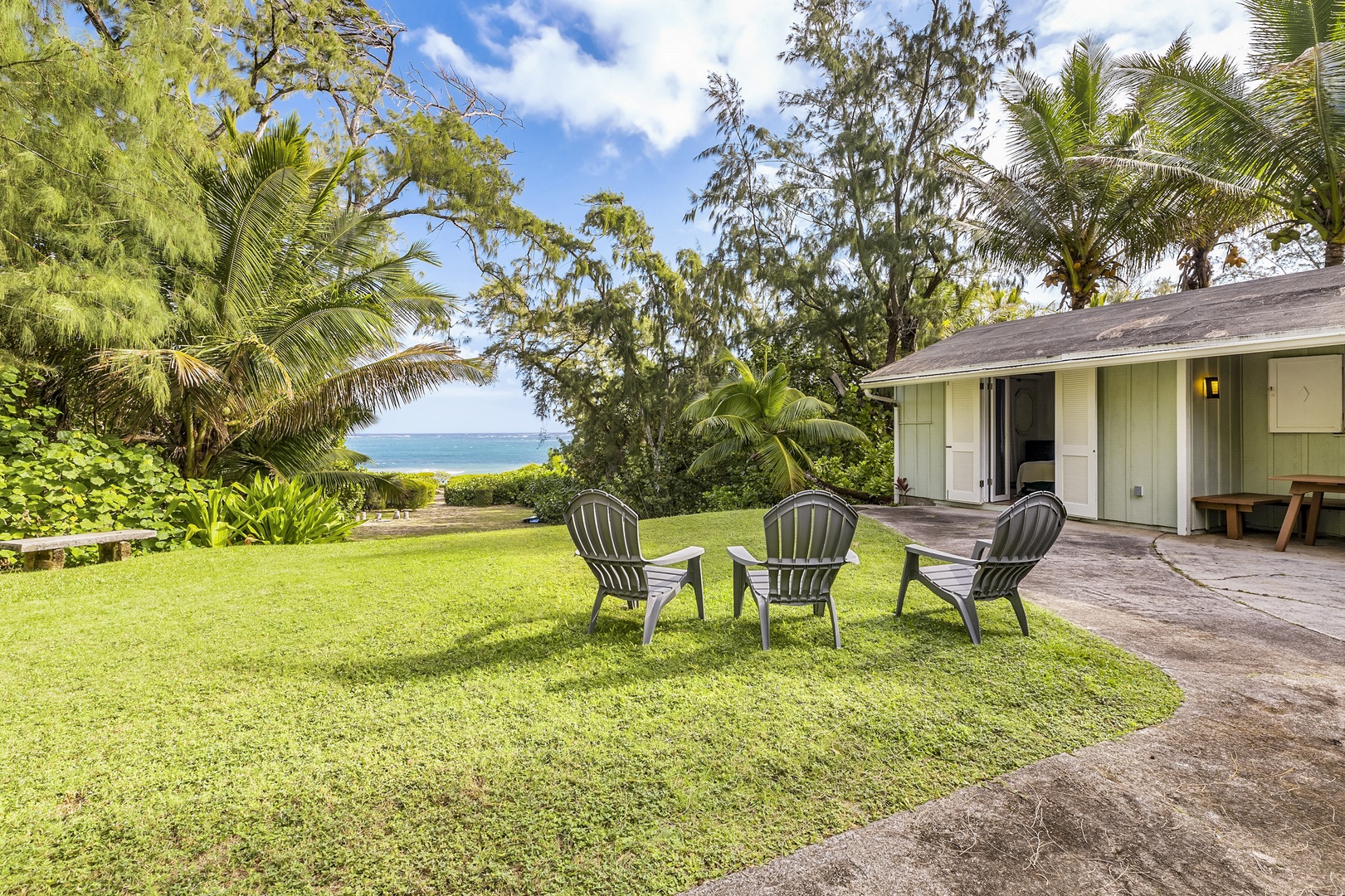 Kahuku Vacation Rentals, Hale Ula Ula - -Seating on the lawn with views of the ocean