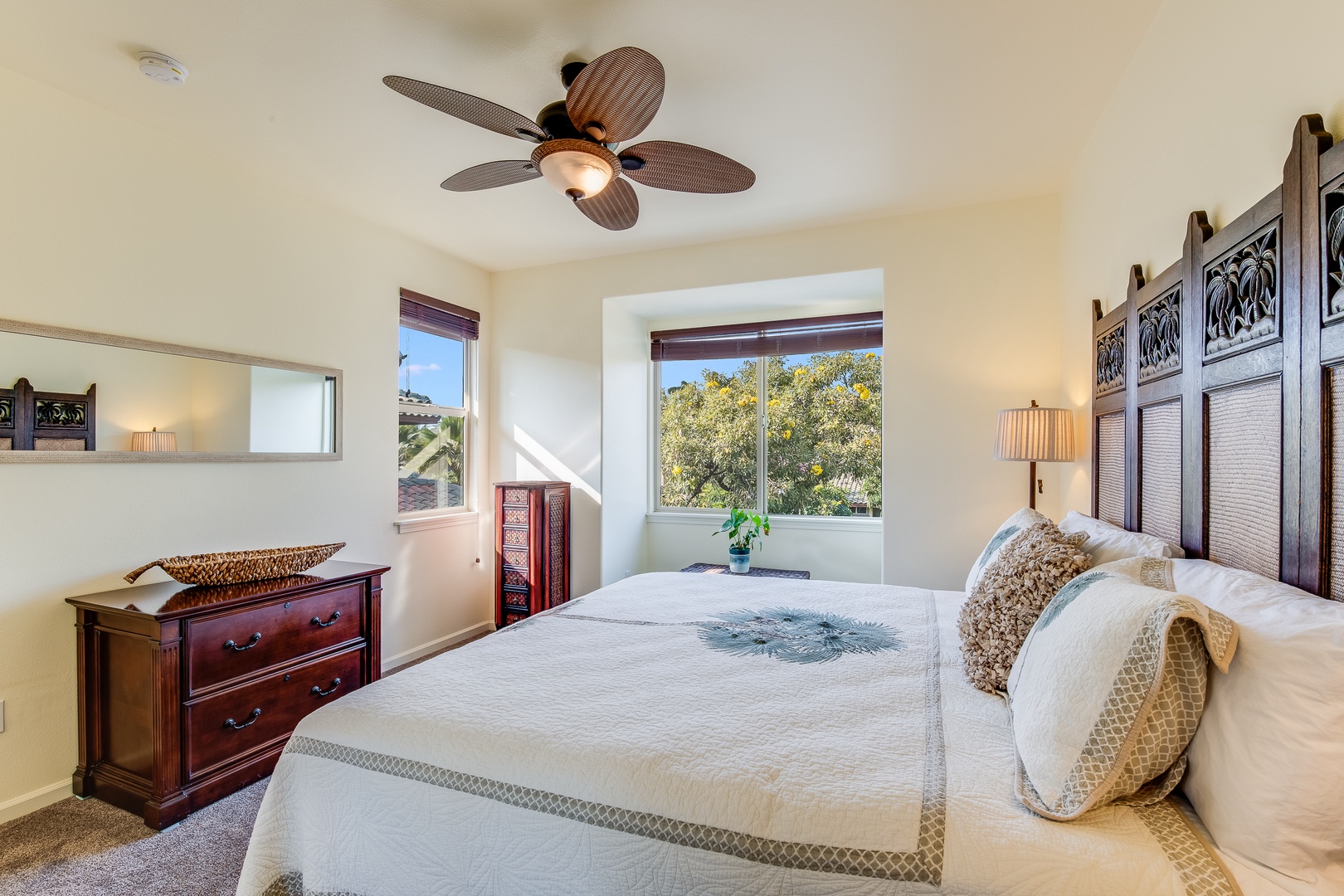 Kamuela Vacation Rentals, Mauna Lani Fairways #204 - The second bedroom includes its own ensuite, ensuring privacy and comfort for guests with a king bed and lush views.