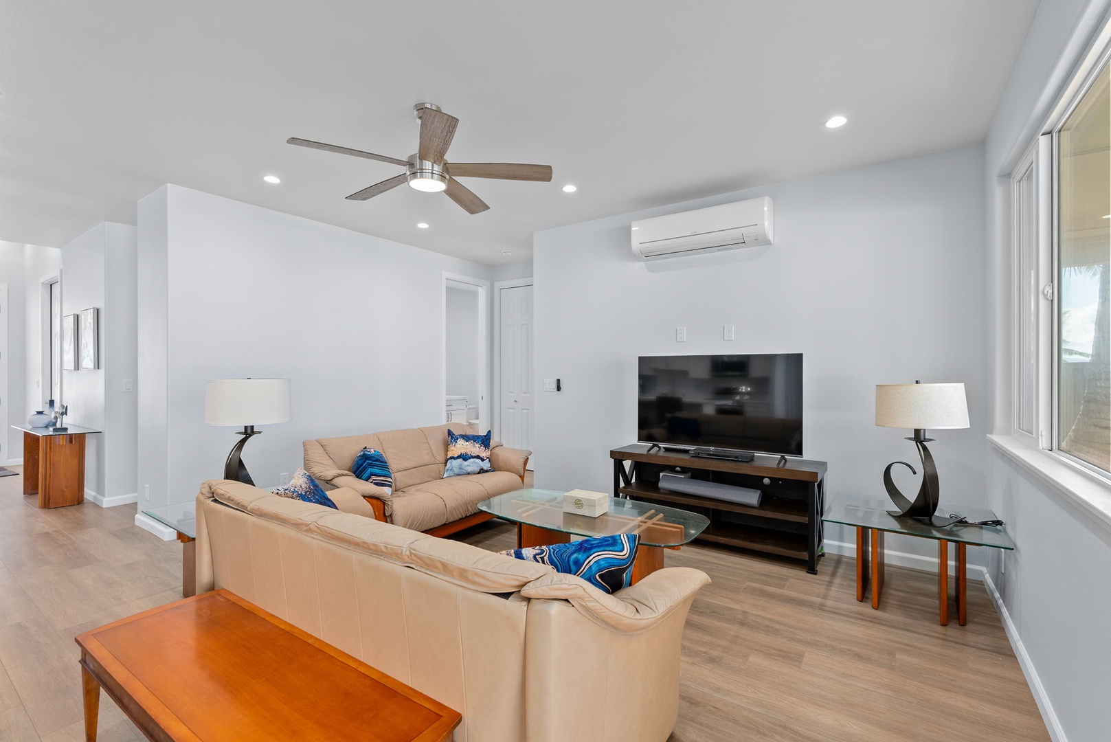 Waianae Vacation Rentals, Oceanfront Luxury Dream Estate - Alternate living room angle with entertainment setup and ample seating under split A/C.