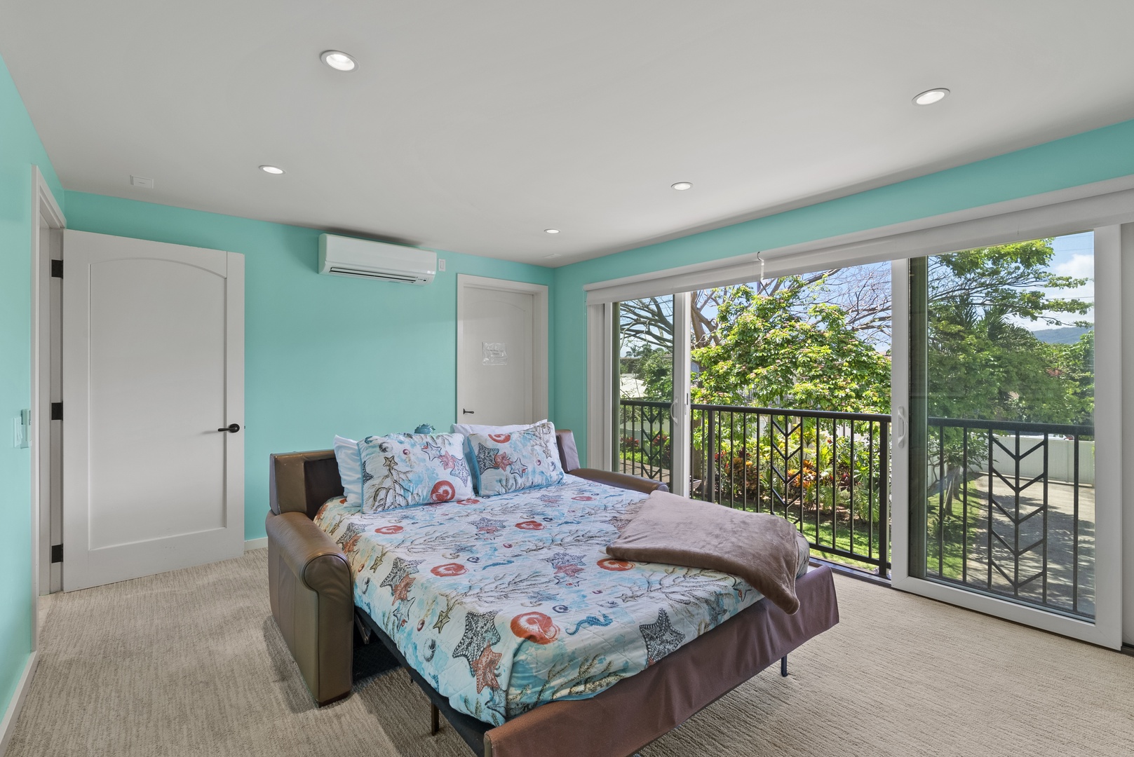 Waialua Vacation Rentals, Waialua Beachfront Estate - The fifth bedroom has a queen-size sleeper sofa and mountain views, but also makes a perfect media room, thanks to its 75-inch television