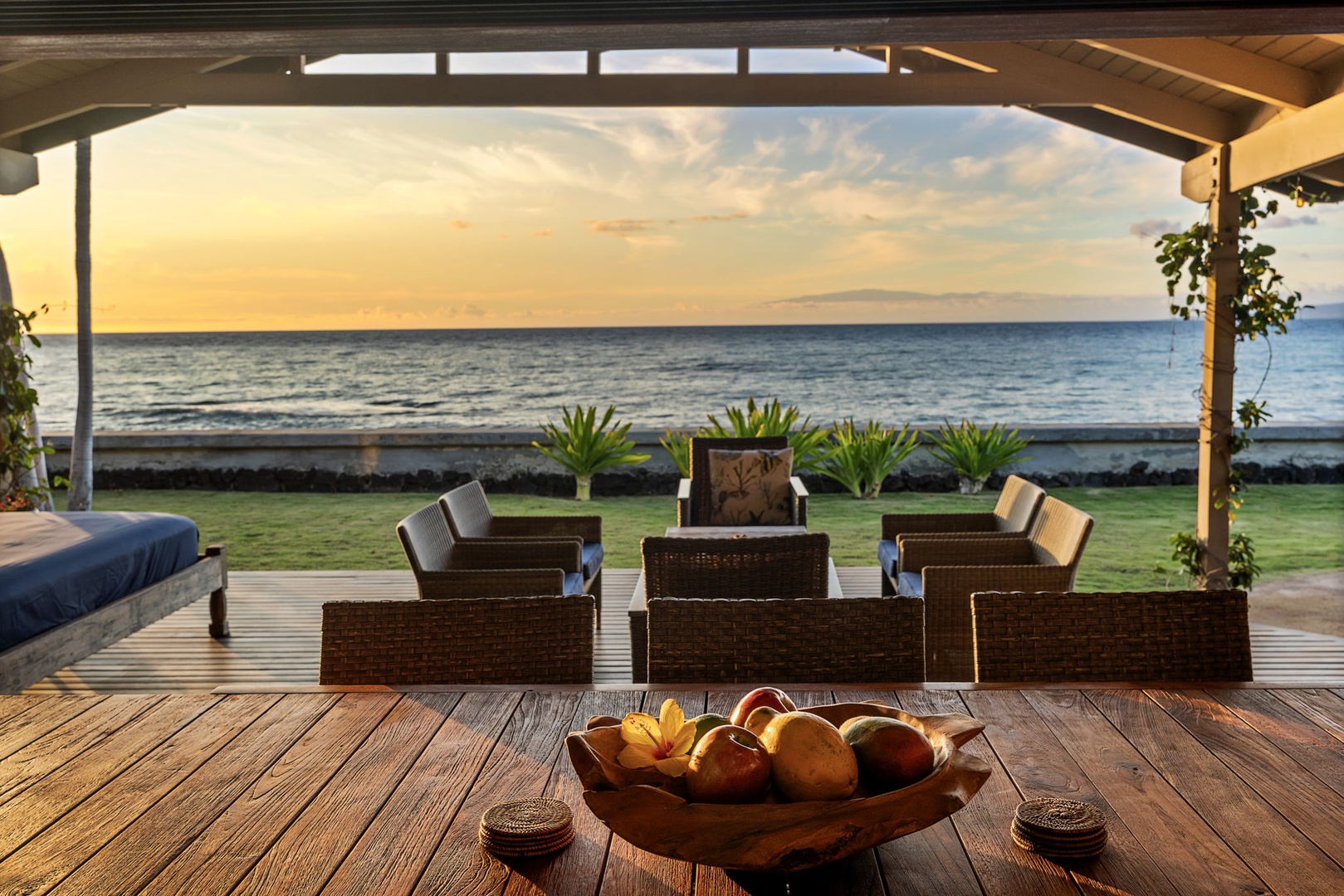 Kamuela Vacation Rentals, Island Time Retreat - A bowl of fruit out on the deck, loungers turned toward the fading light.
