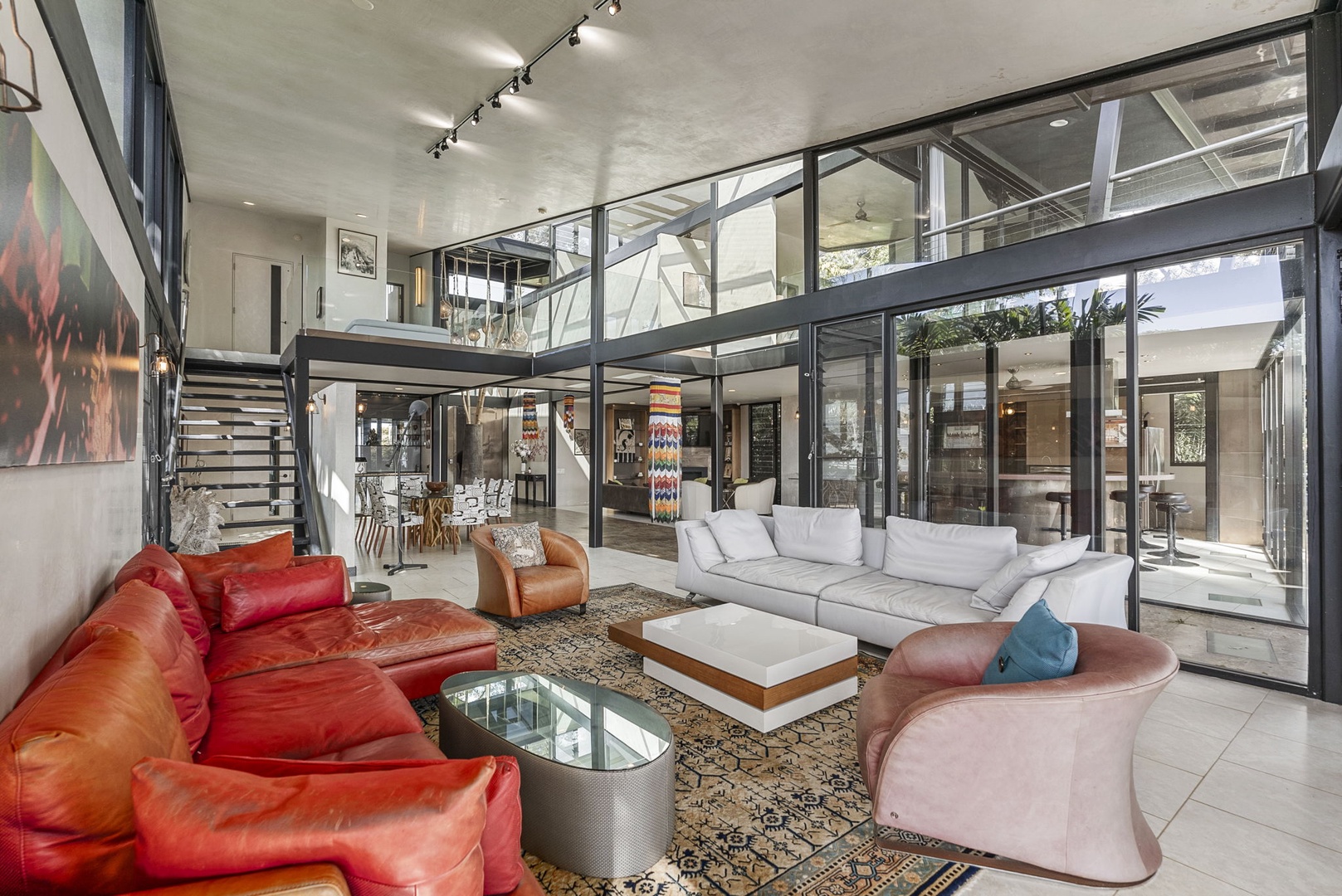 Honolulu Vacation Rentals, Tantalus Glass House (3 BD) - Sink into luxurious leather seating in this stunning open-concept living space, where floor-to-ceiling windows flood your retreat with natural light.