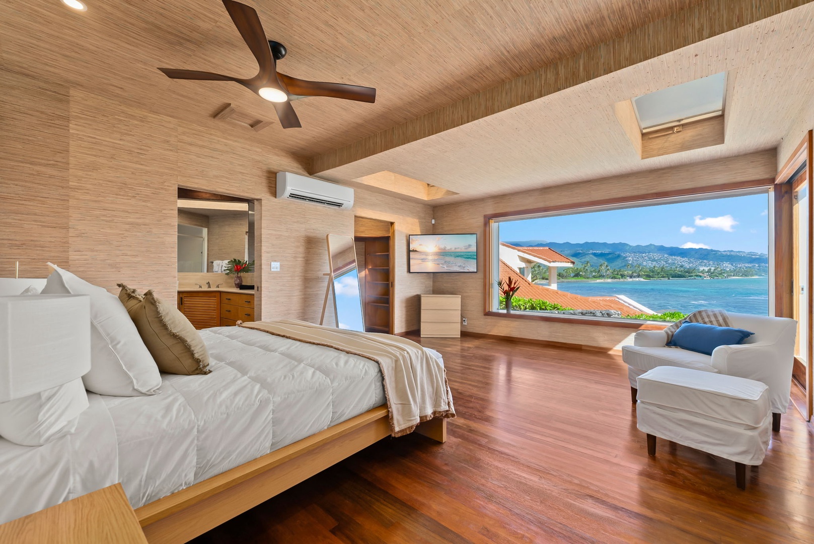 Honolulu Vacation Rentals, Black Point Ocean Villa - Wake up to stunning ocean views from your luxurious bedroom, where warm wood tones and crisp linens create your perfect retreat.