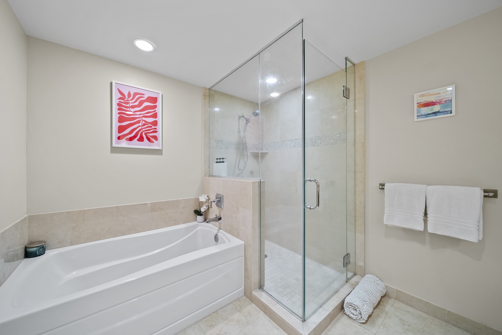 Honolulu Vacation Rentals, Watermark Waikiki Unit 901 - The ensuite bathroom with a shower/tub combo and a separate walk-in shower.