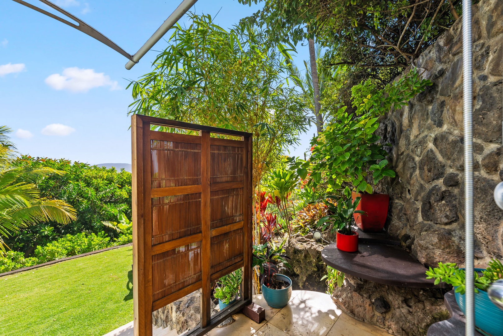 Honolulu Vacation Rentals, Kahala Hills Estate - Surrounded by greenery, this open-air shower offers a refreshing, nature-connected experience.