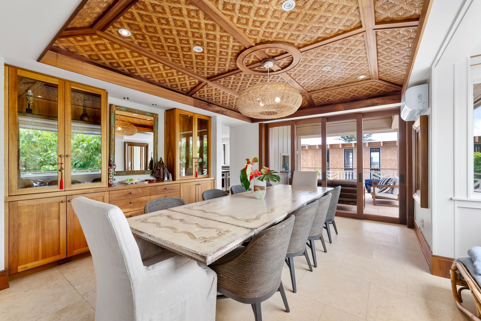 Kailua Vacation Rentals, Leaf House - Gather around the stunning marble dining table beneath handwoven bamboo ceiling panels, where tropical breezes drift through open doors and warm wood tones create an inviting space for memorable meals together.
