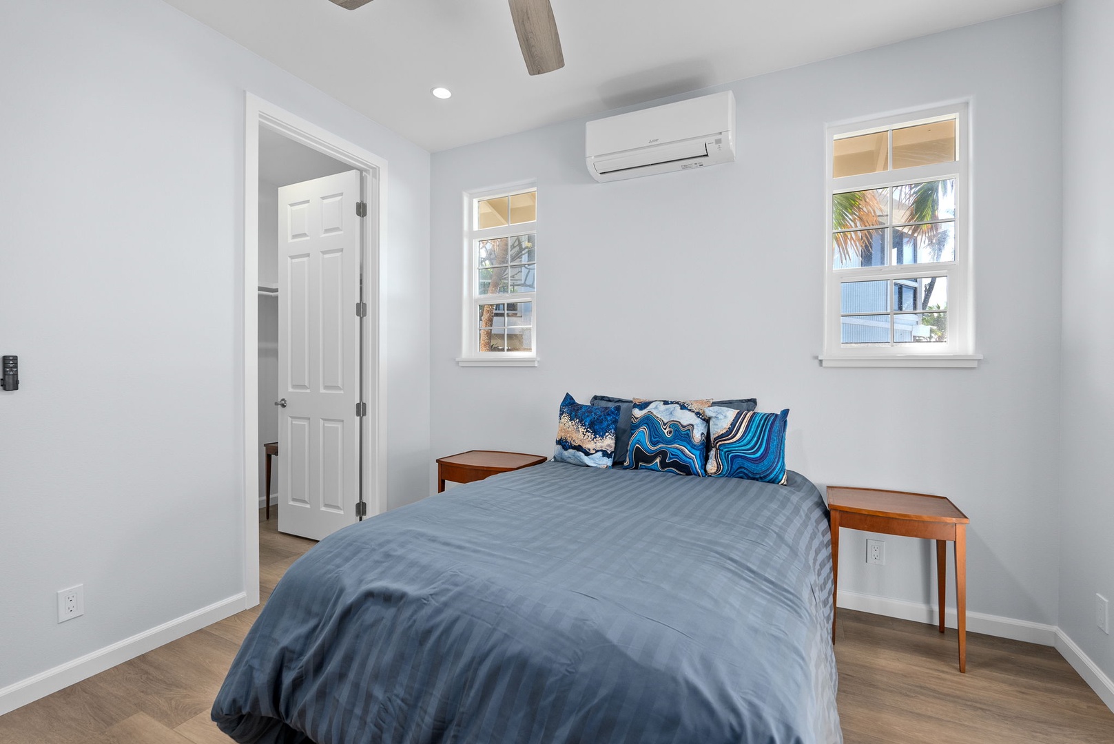 Waianae Vacation Rentals, Oceanfront Luxury Dream Estate - The downstairs guest suite features cool tones, natural light, and serene garden views for a peaceful stay.