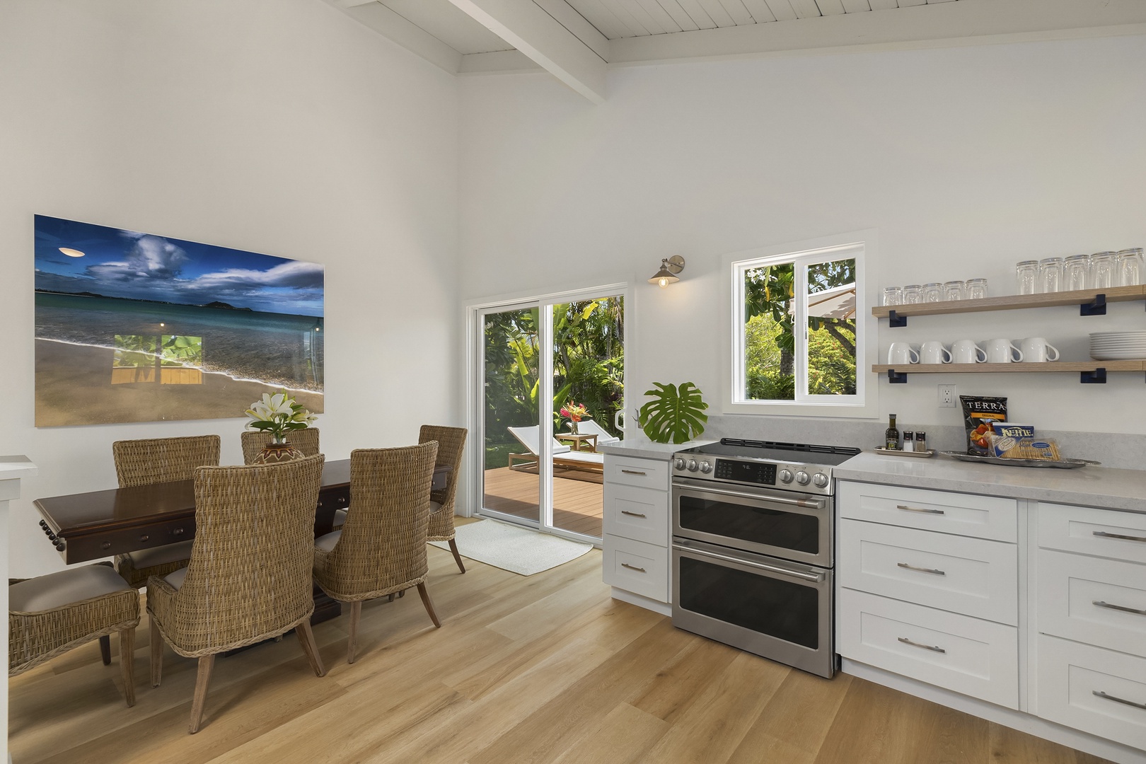 Kailua Vacation Rentals, Ranch Beach House - Dining Room with natural lighting and opens to main lanai and garden area.