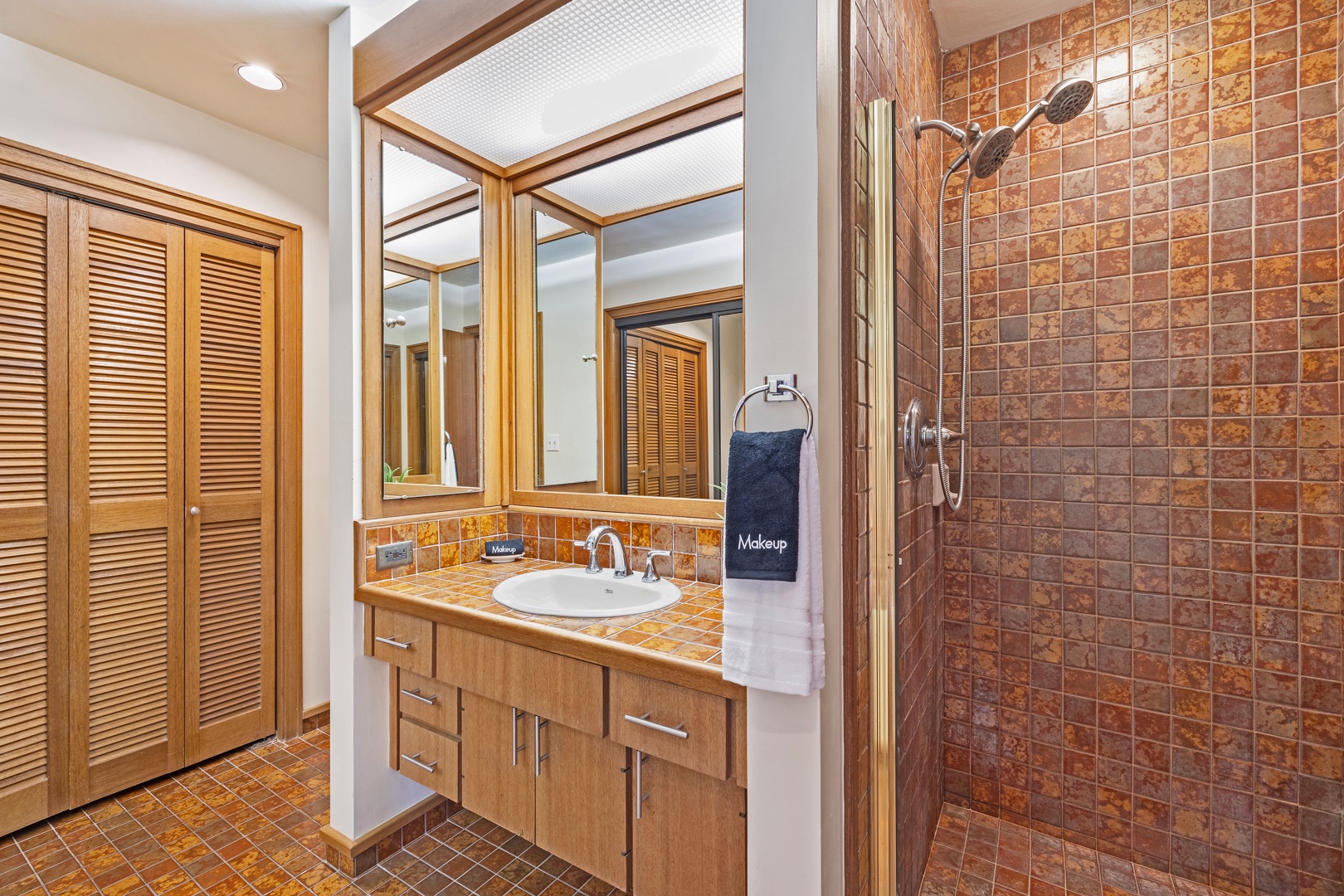 Lahaina Vacation Rentals, Kapalua Ridge 2321 - Refresh in the sleek bathroom at Kapalua Ridge 2321, complete with a walk-in shower and bright vanity.