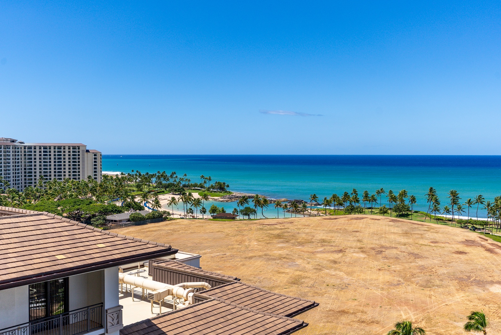Kapolei Vacation Rentals, Ko Olina Beach Villas O1404 - The lagoon curves toward the open water, calm and turquoise from up here.