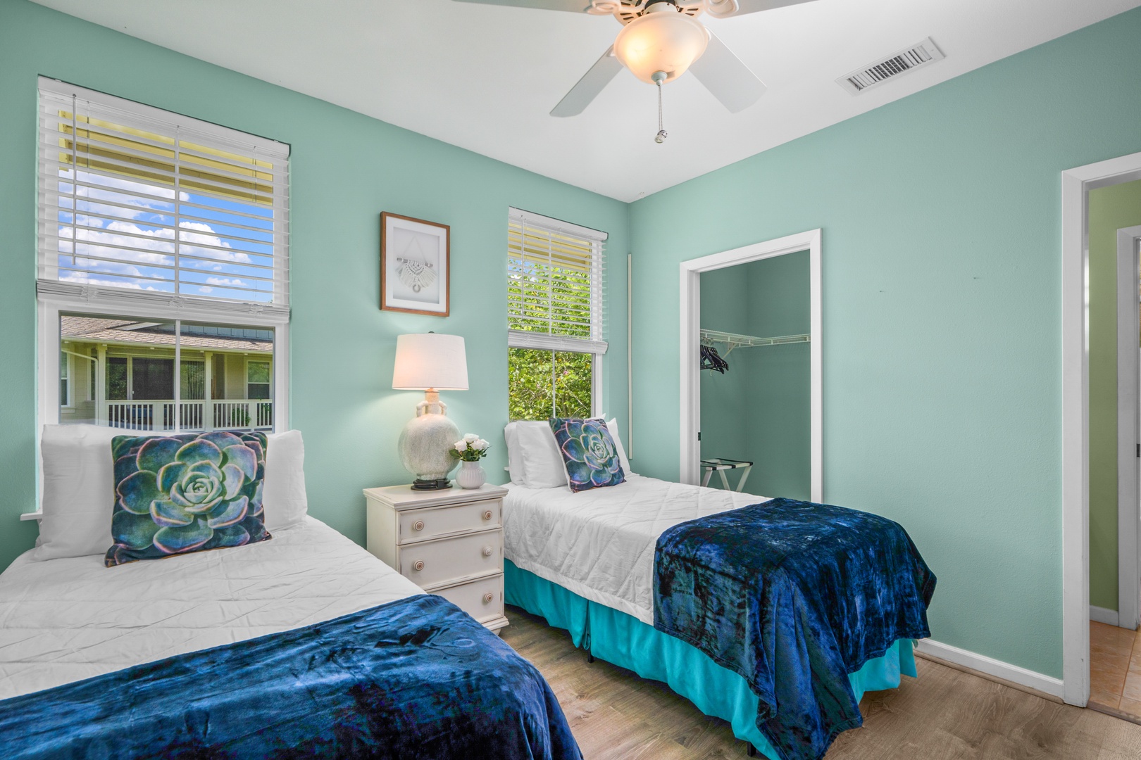 Princeville Vacation Rentals, Kaimana Villa - Rest peacefully in your serene twin bedroom, where calming turquoise walls and ocean-inspired linens create the perfect coastal retreat for your stay.