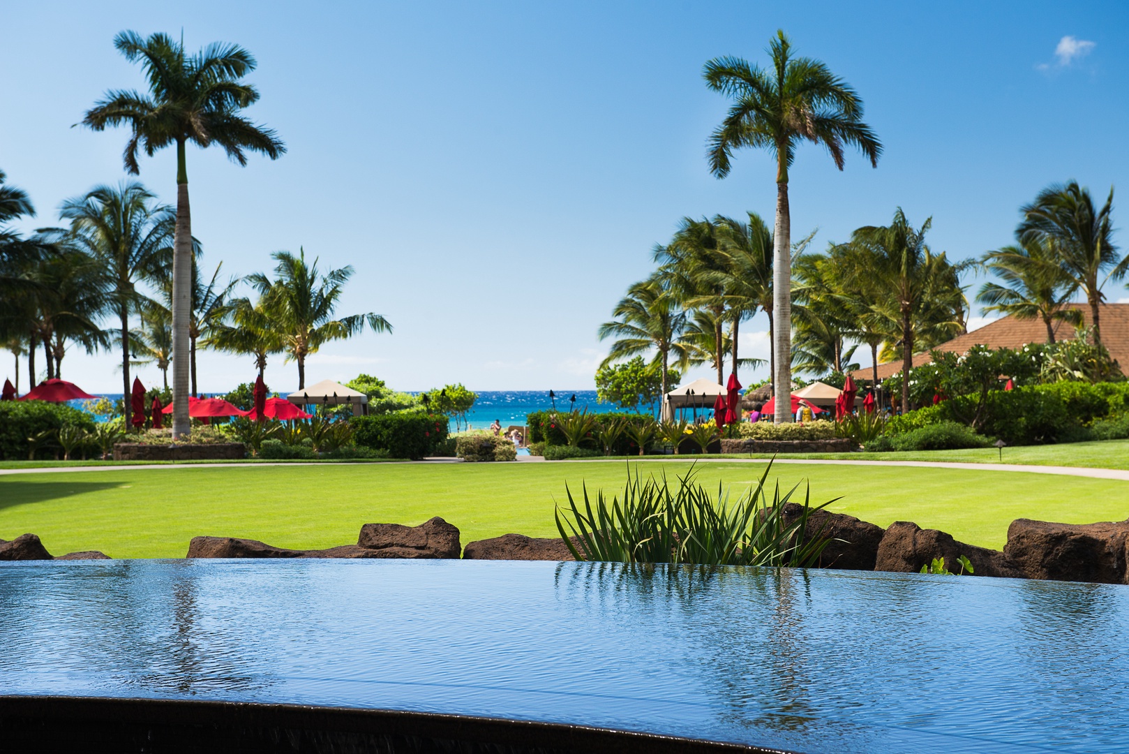Lahaina Vacation Rentals, Honua Kai Konea 204 - Palm-framed water features surround Honua Kai Konea 204 with a lush, relaxing atmosphere.