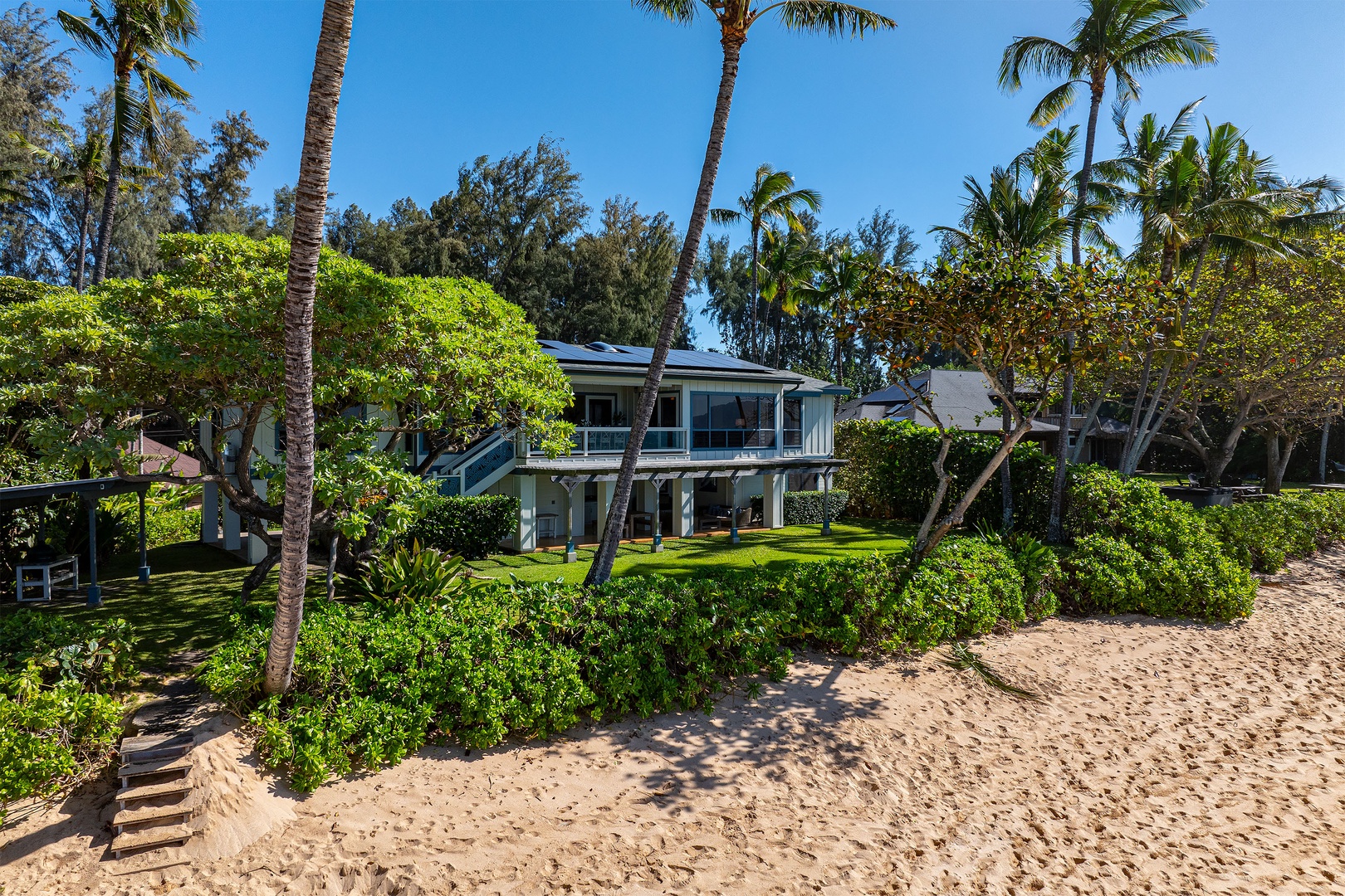 Haleiwa Vacation Rentals, Maluhia Beach House - Step onto the sandy shore just outside your door and soak in the beauty of island living.