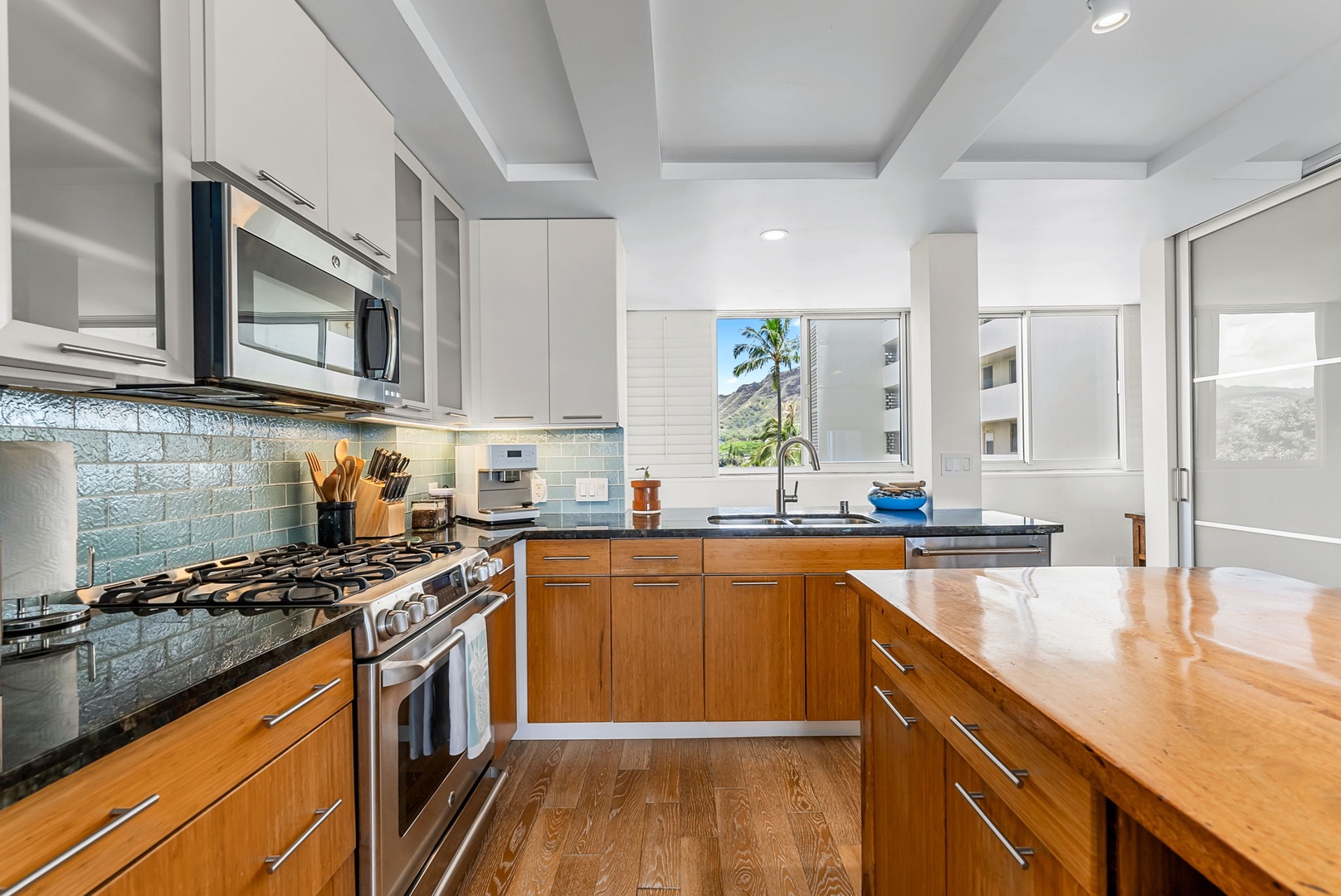 Honolulu Vacation Rentals, Colony Surf Luxe - Bright, modern kitchen space with stainless steel appliances and sleek design.