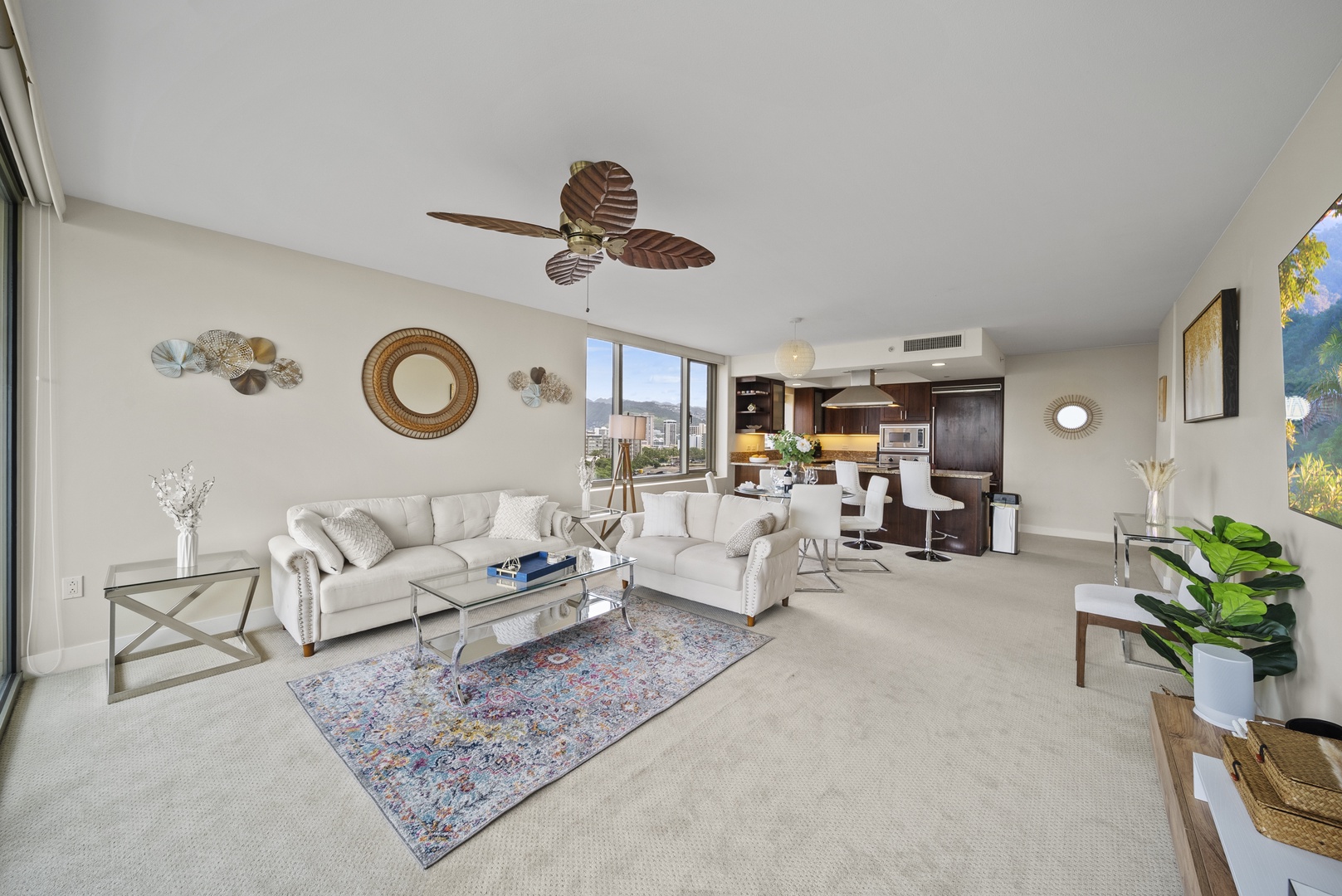 Honolulu Vacation Rentals, Watermark Waikiki Unit 901 - The spaciously designed living area has plush sofas and large windows and sliders for seamless indoor-outdoor living.