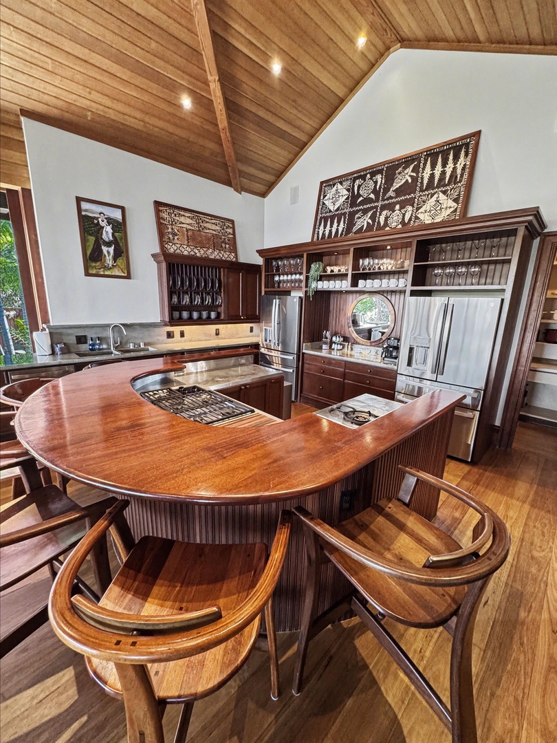 Kailua-Kona Vacation Rentals, Hahalua Bay Villa - Step into this stunning gourmet kitchen where rich wood finishes and soaring ceilings create your perfect culinary sanctuary.