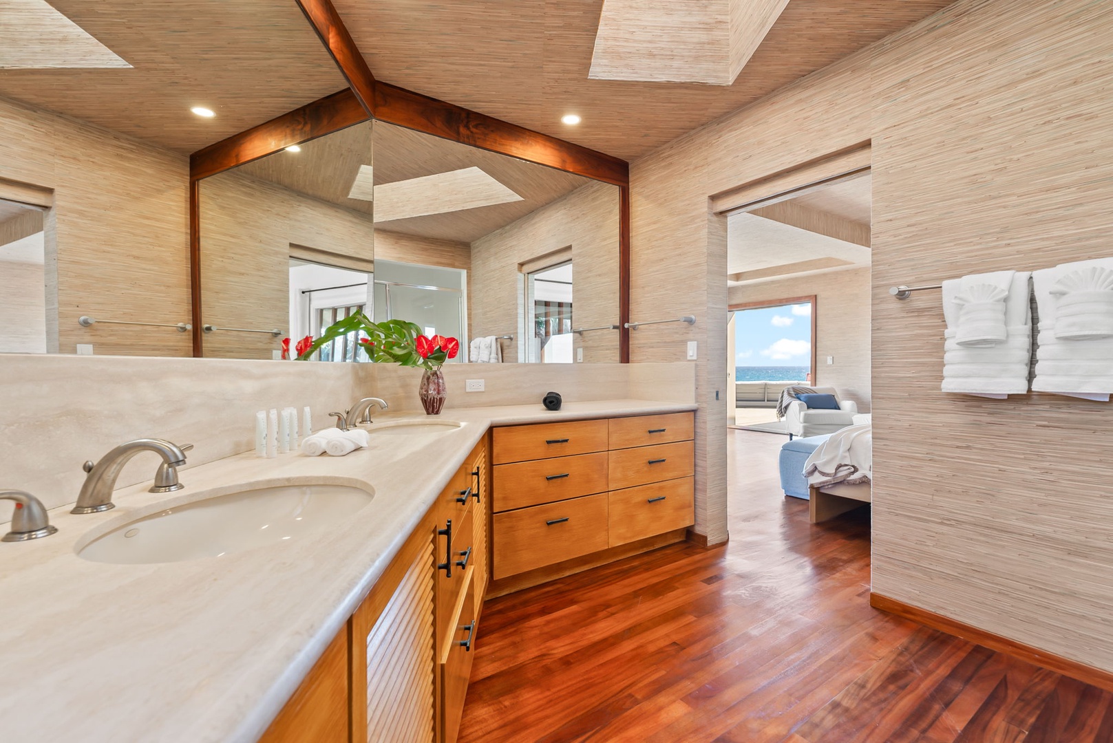 Honolulu Vacation Rentals, Black Point Ocean Villa - Dual vanities, warm wood finishes, and serene views beyond.