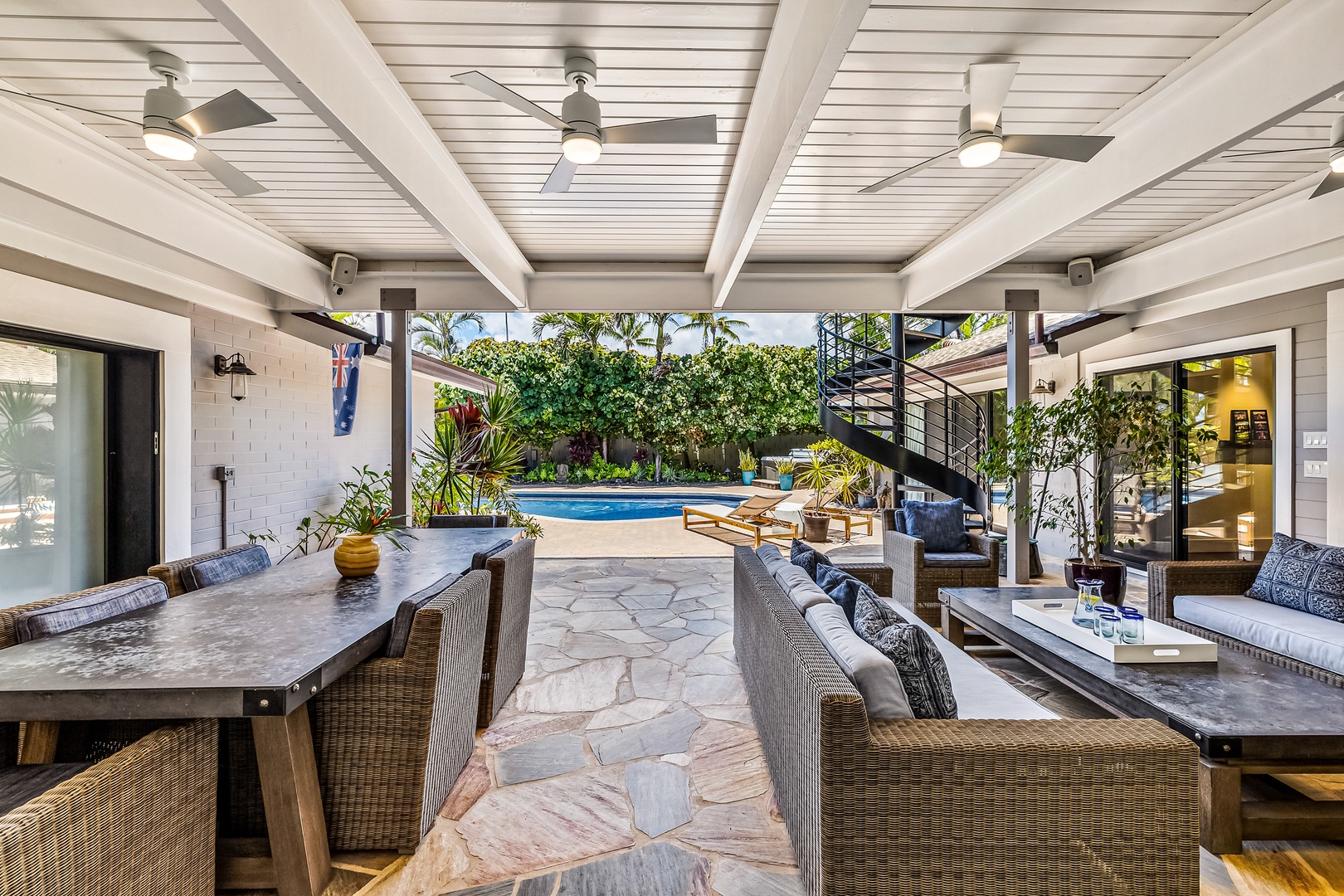 Kailua Vacation Rentals, Hale Ohana - Take a seat under the covered lanai with views of the pool and garden