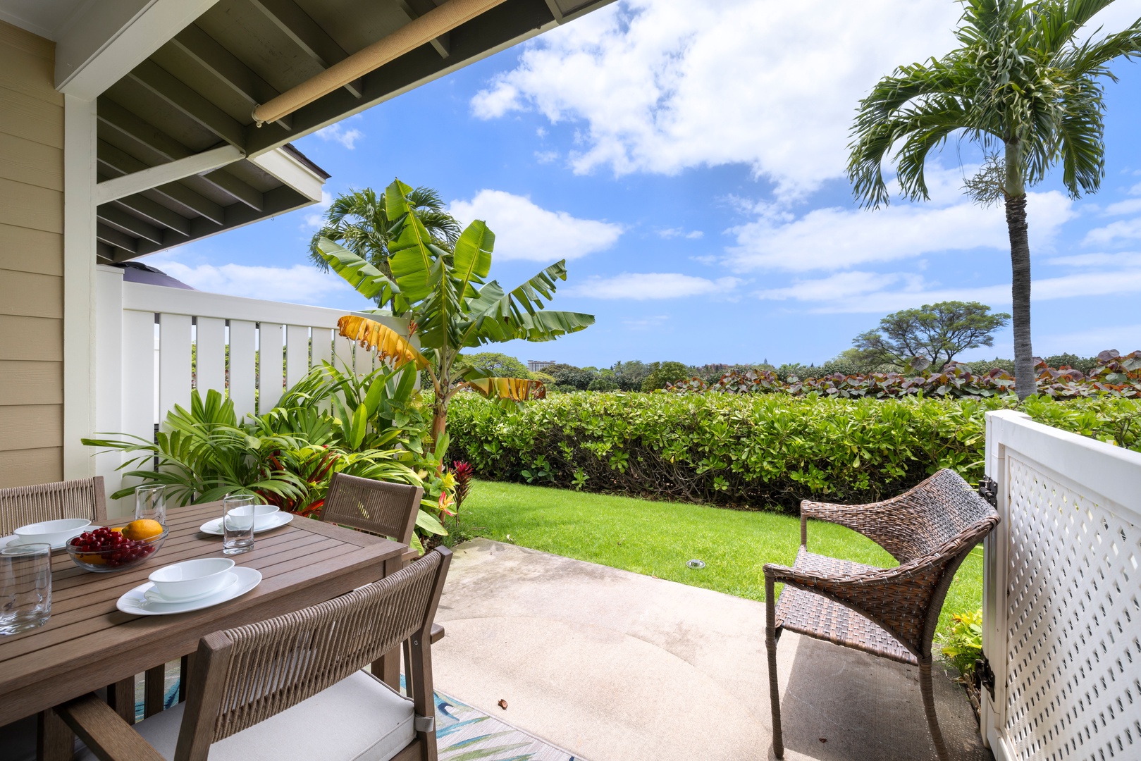 Kapolei Vacation Rentals, Hillside Villas 1498-3 - Enjoy a meal or a drink on the lanai while taking in the lush garden views.