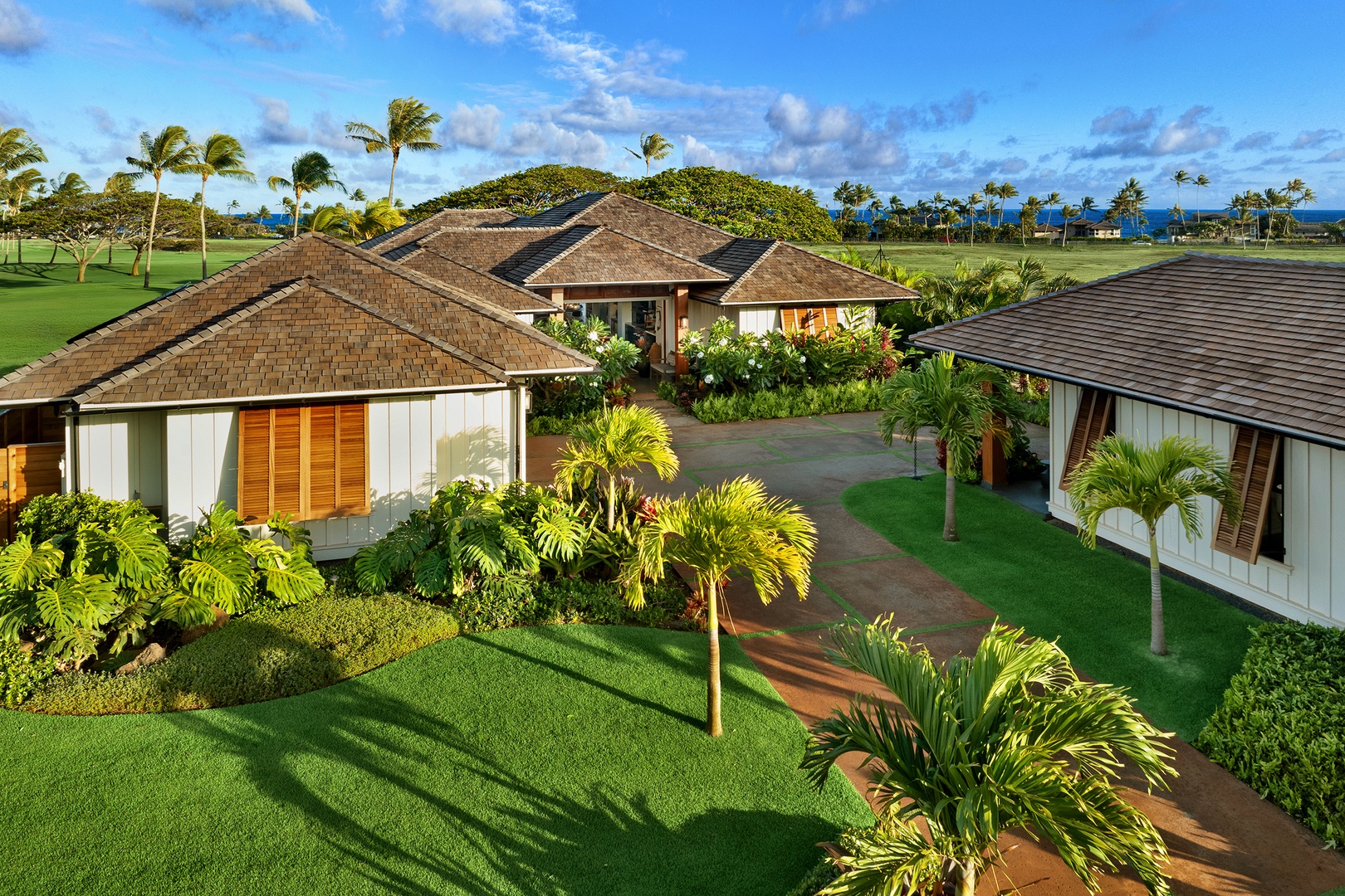 Koloa Vacation Rentals, Hale Pakika at Kukui'ula - Spacious estate with private pool and sunset views, surrounded by lush island greenery.