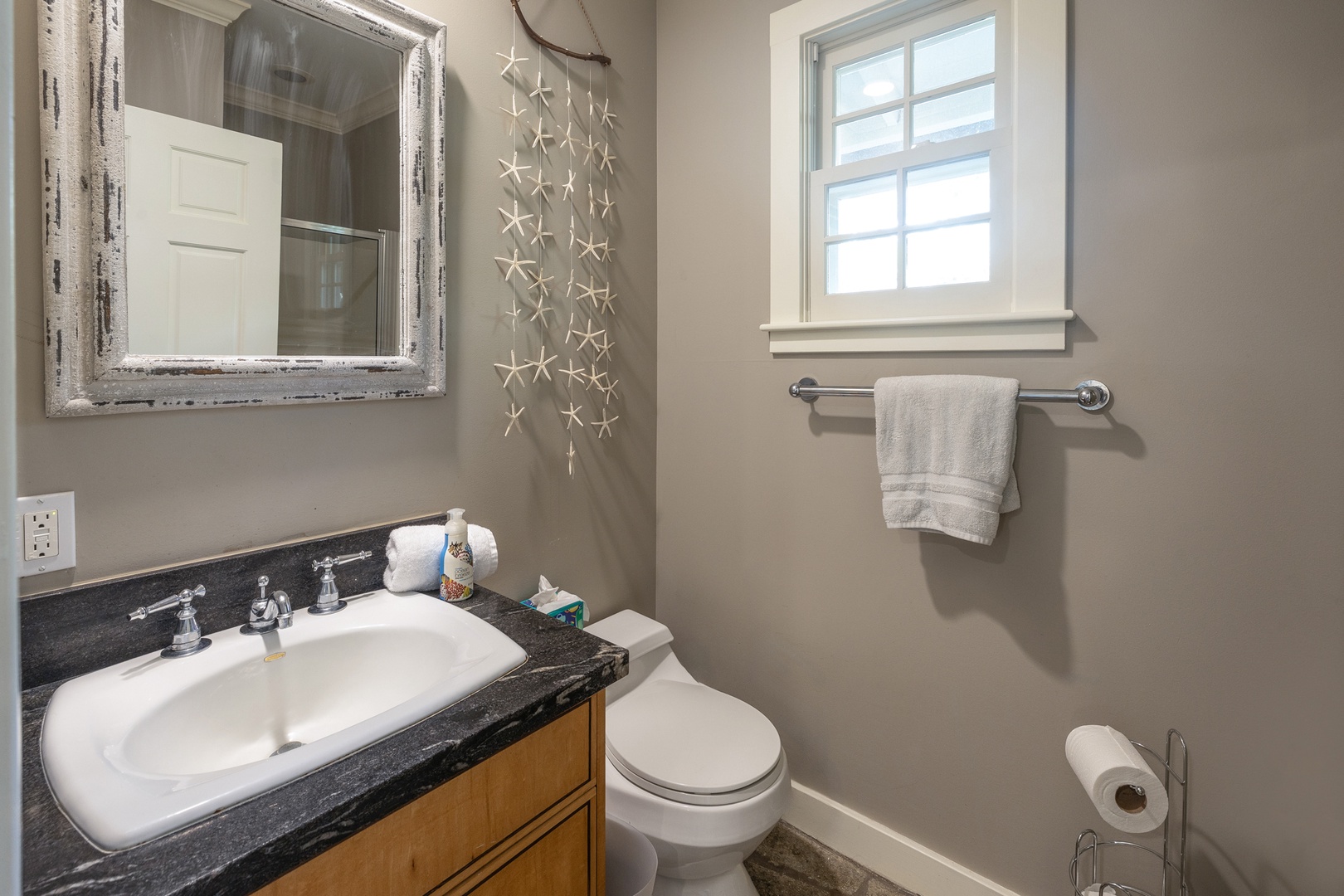 Honolulu Vacation Rentals, Moana Lani - Convenient Pool Room bathroom featuring coastal accents.