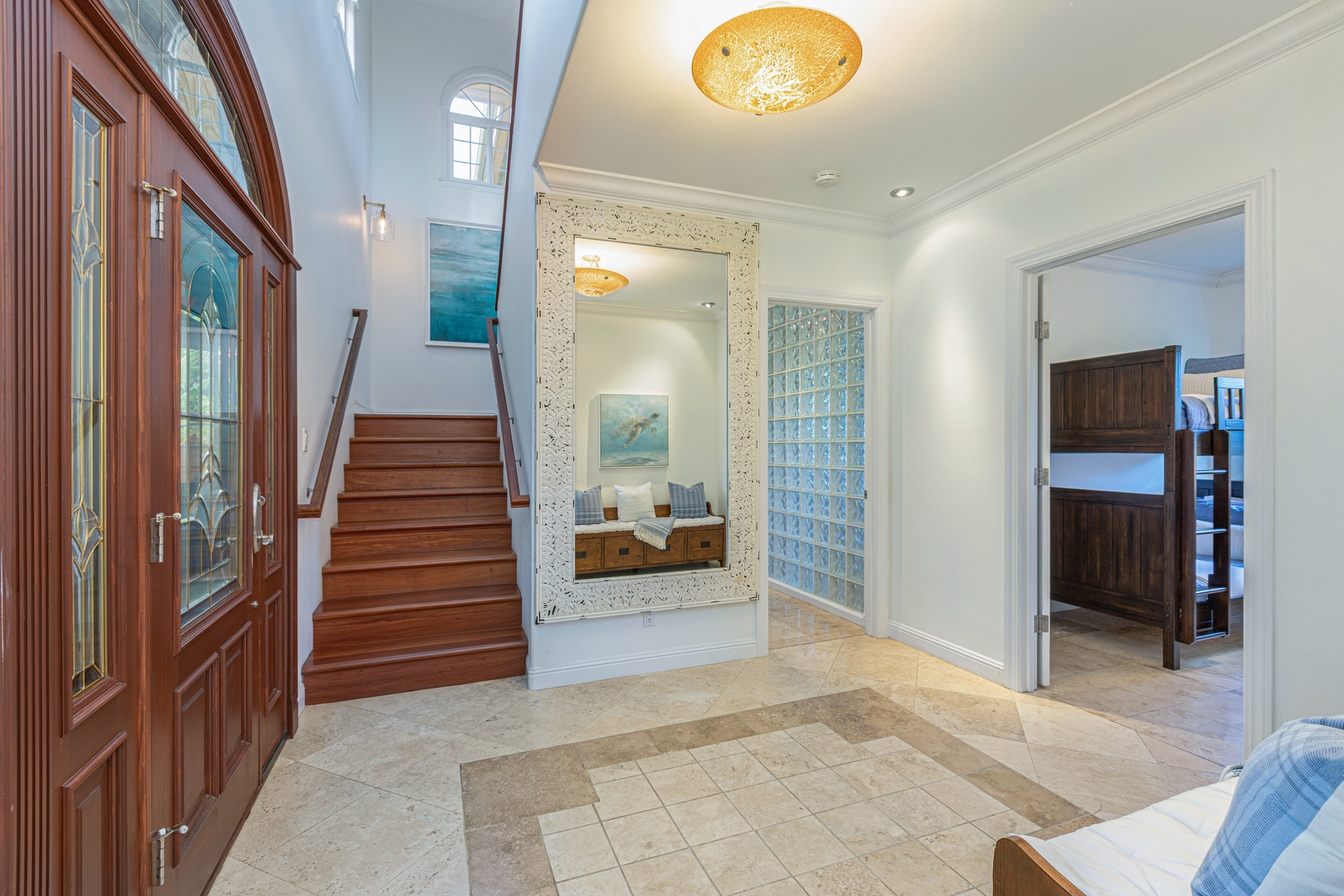 Princeville Vacation Rentals, Ohana Kamalani - Inviting entryway with elegant tile flooring and natural light, welcoming guests into your Princeville retreat.