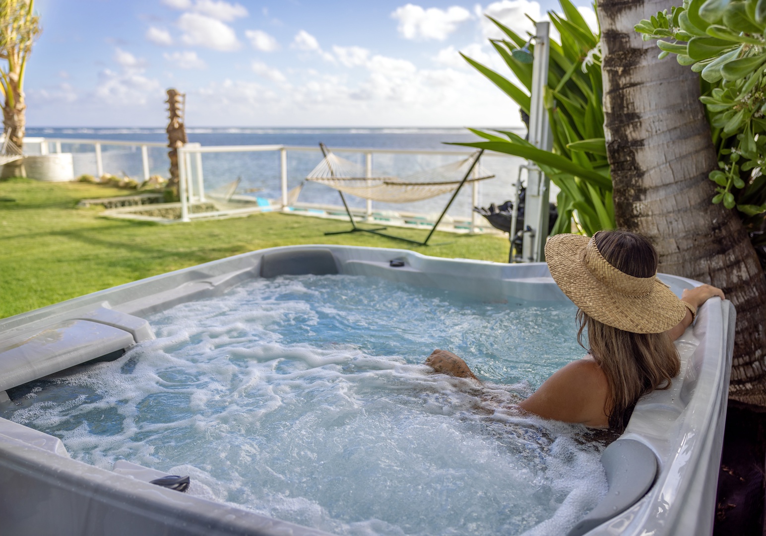 Hauula Vacation Rentals, Private Beach Paradise - The hot tub looks straight out to the reef, best claimed early in the morning.