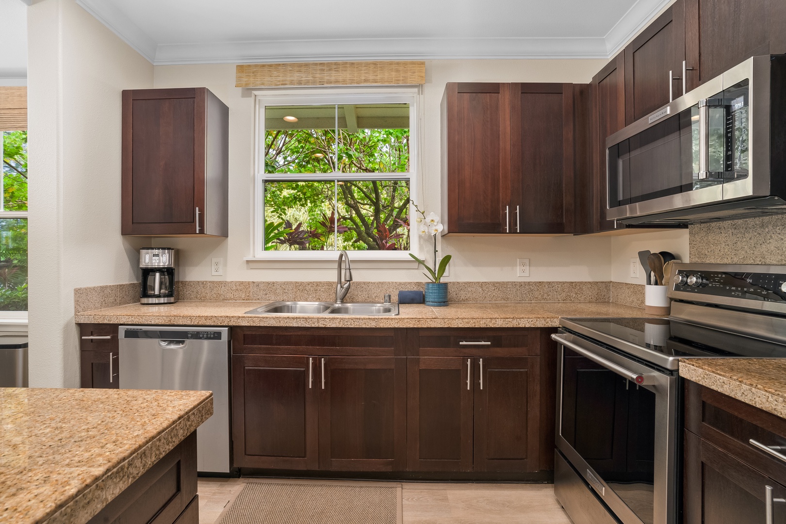 Princeville Vacation Rentals, Hale Kaua'i - Prepare island-inspired meals in the fully equipped kitchen with ample counter space.