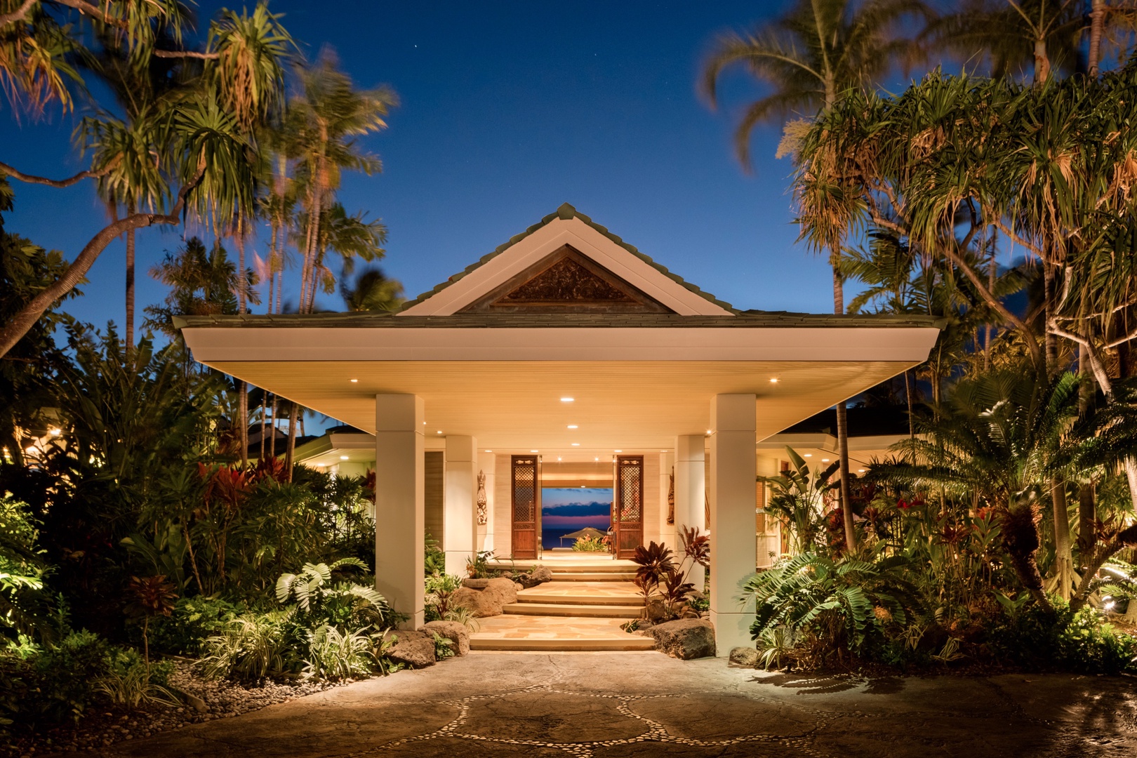 Kamuela Vacation Rentals, 5BD Fairways North (1) Estate Home at Mauna Kea Resort - Grand entryway with tropical landscaping lit up at twilight.