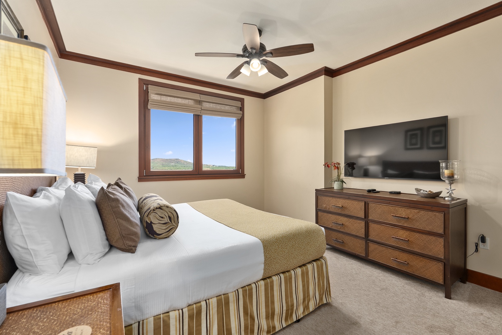 Kapolei Vacation Rentals, Ko Olina Beach Villas O1404 - Turn in in the primary suite, king bed facing the windows and a Smart TV for quiet nights.