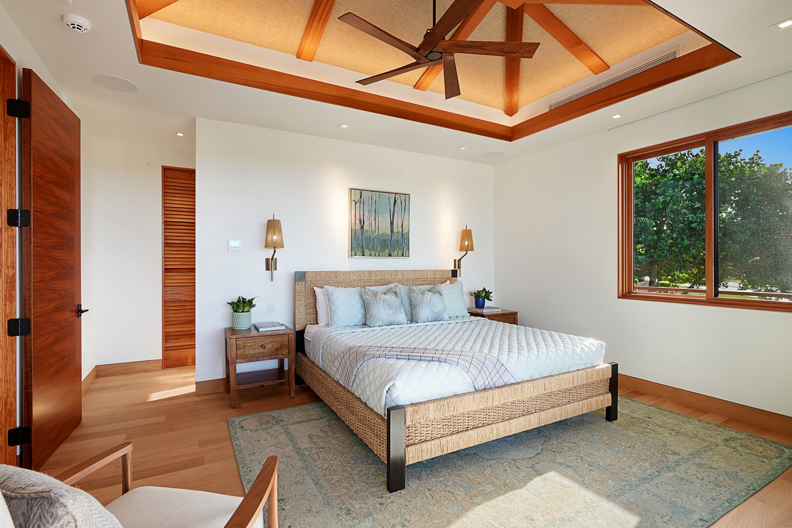 Koloa Vacation Rentals, Hale Kai'Opua - Spacious primary bedroom with a king-size bed and vaulted ceilings.