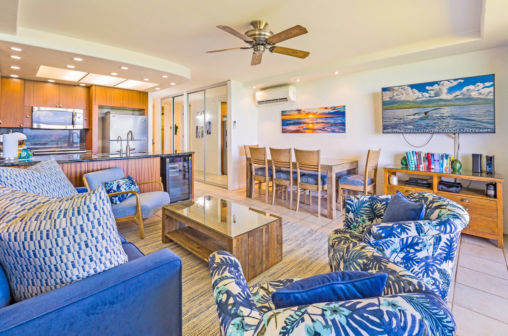 Lahaina Vacation Rentals, Papakea L-106 - An inviting open-concept living and dining area with tropical-themed décor and a ceiling fan, ideal for relaxing after a day at the beach