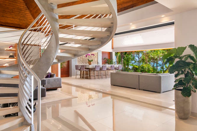 Honolulu Vacation Rentals, Diamond Head Beachfront Estate - Modern spiral staircase connects two levels of elegance with uninterrupted ocean views.
