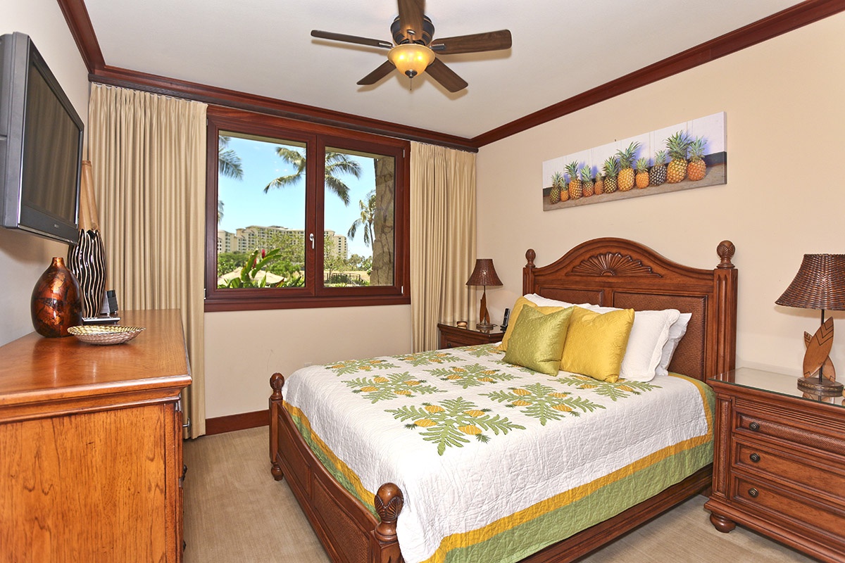 Kapolei Vacation Rentals, Ko Olina Beach Villas B103 - The second guest bedroom with a comfortable queen bed and TV.