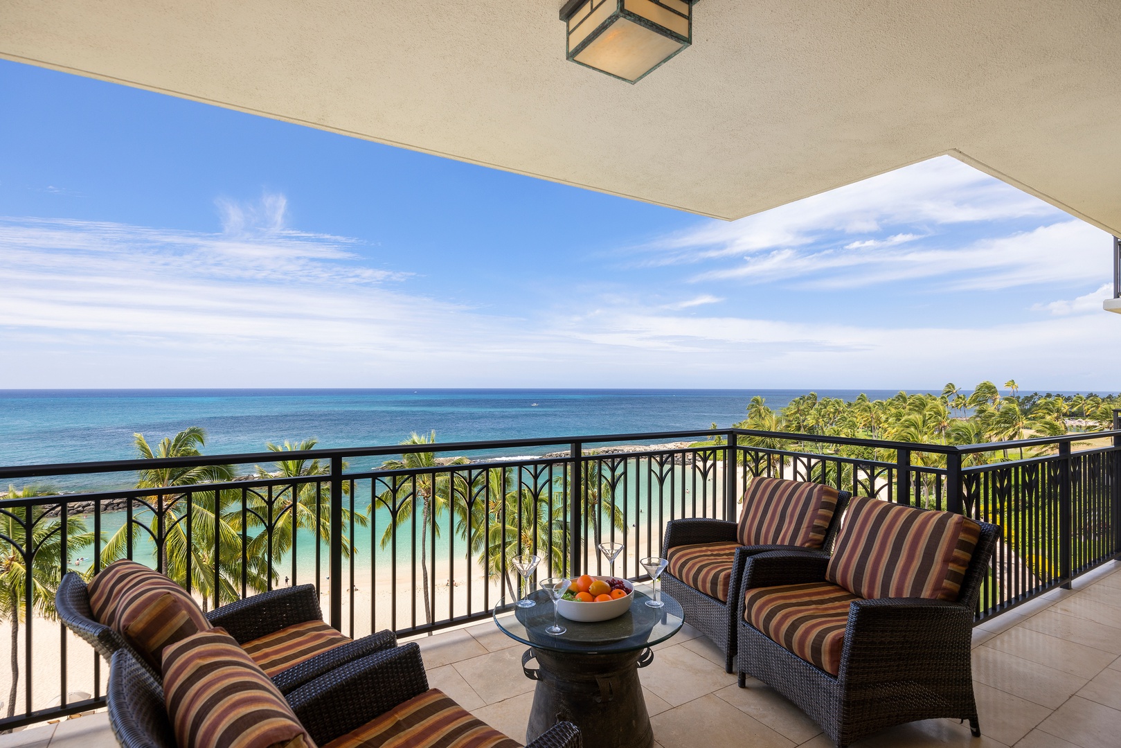 Kapolei Vacation Rentals, Ko Olina Beach Villas B609 - Sip your morning coffee while gazing at turquoise waters from your private lanai, where striped cushions invite relaxation.