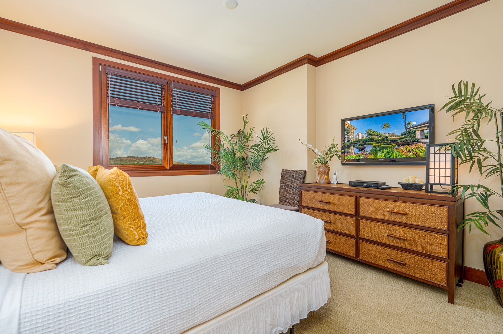 Kapolei Vacation Rentals, Ko Olina Beach Villas O904 - The primary guest bedroom with a TV and dresser.