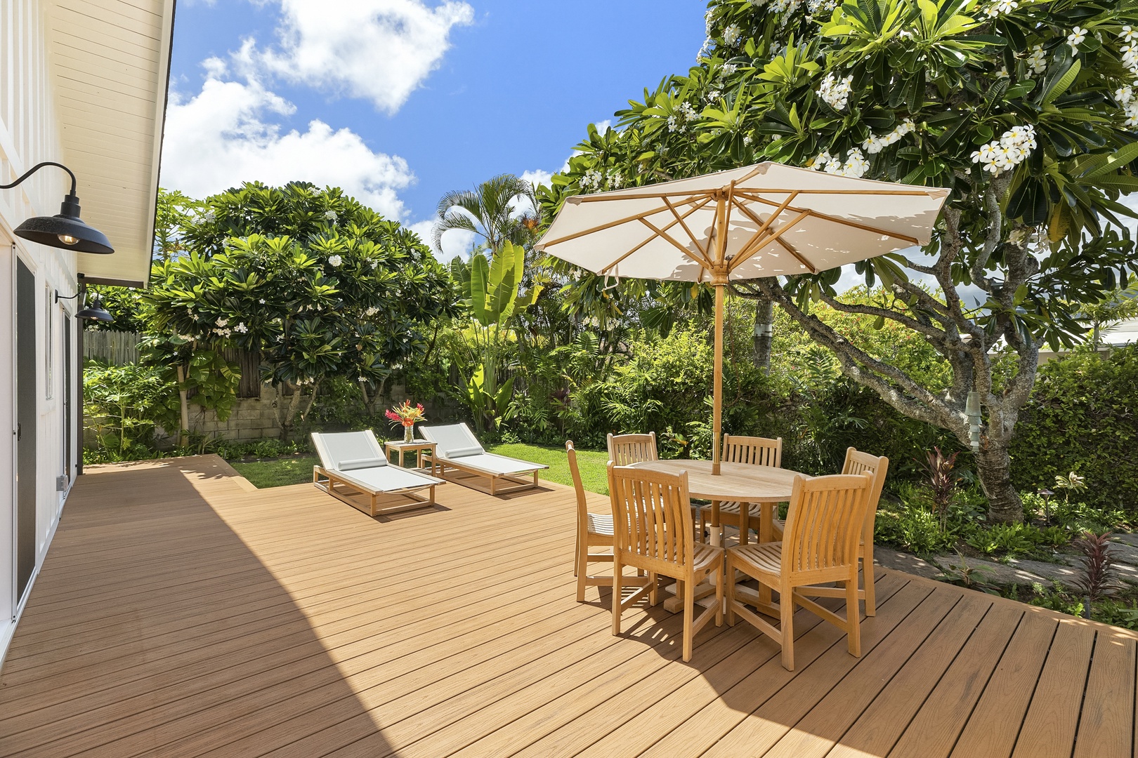 Kailua Vacation Rentals, Ranch Beach House - Private, Calm, and peaceful main lanai and garden area. Large deck with Chaise loungers for soaking up the sun and outdoor seating area.