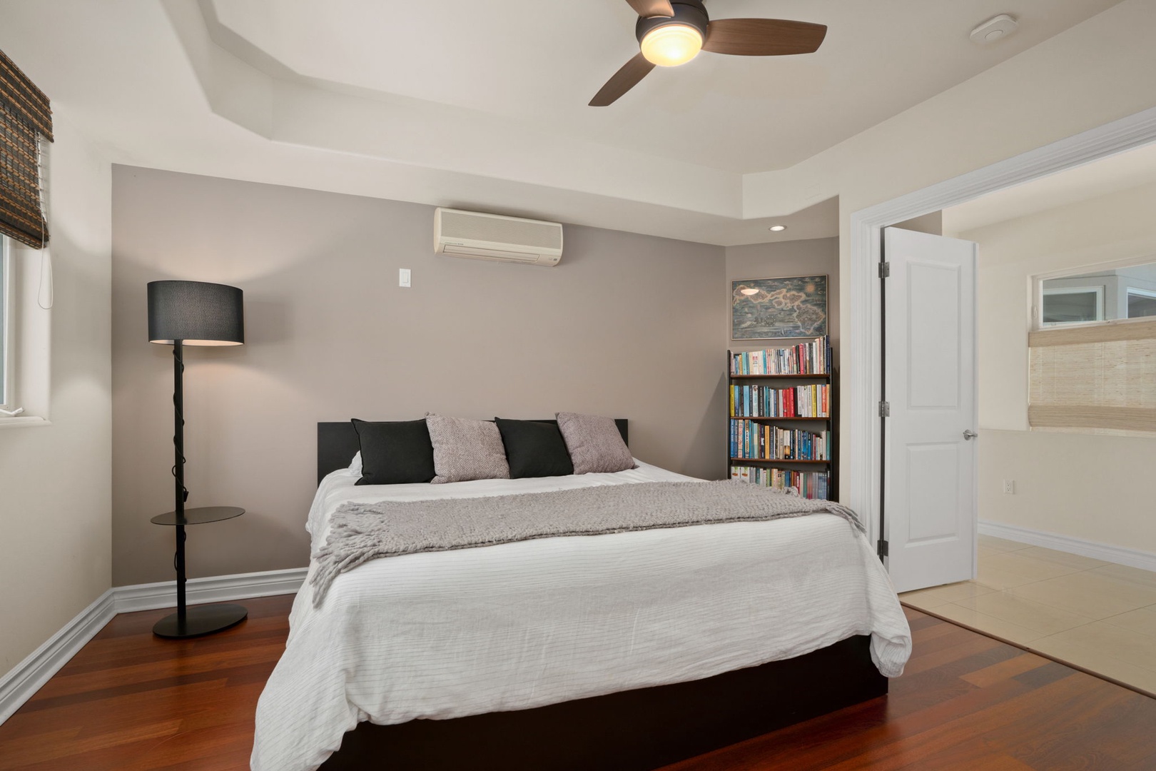 Princeville Vacation Rentals, Kaiulani #8 - A full bookshelf by the bed means nobody runs out of vacation reading.