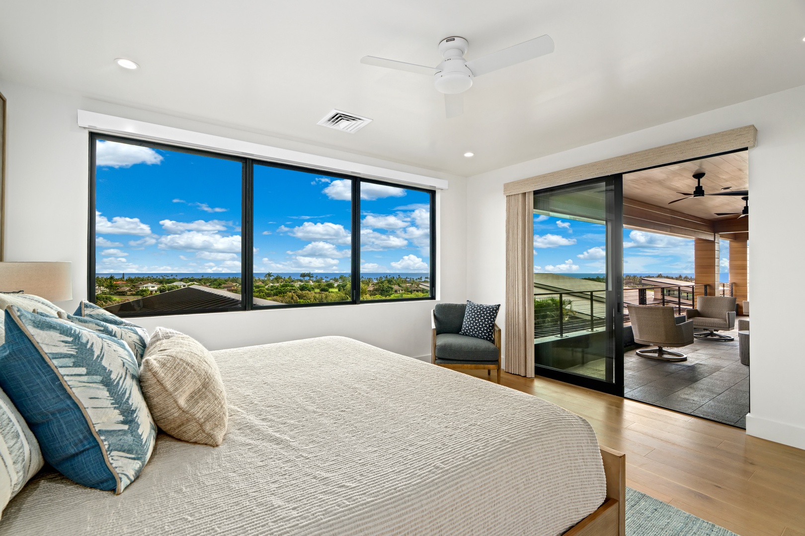 Koloa Vacation Rentals, Hale Laule'a at Kukui'ula - Wake up to stunning views through floor-to-ceiling windows. Your spacious bedroom opens to a private balcony, perfect for morning coffee with panoramic vistas.