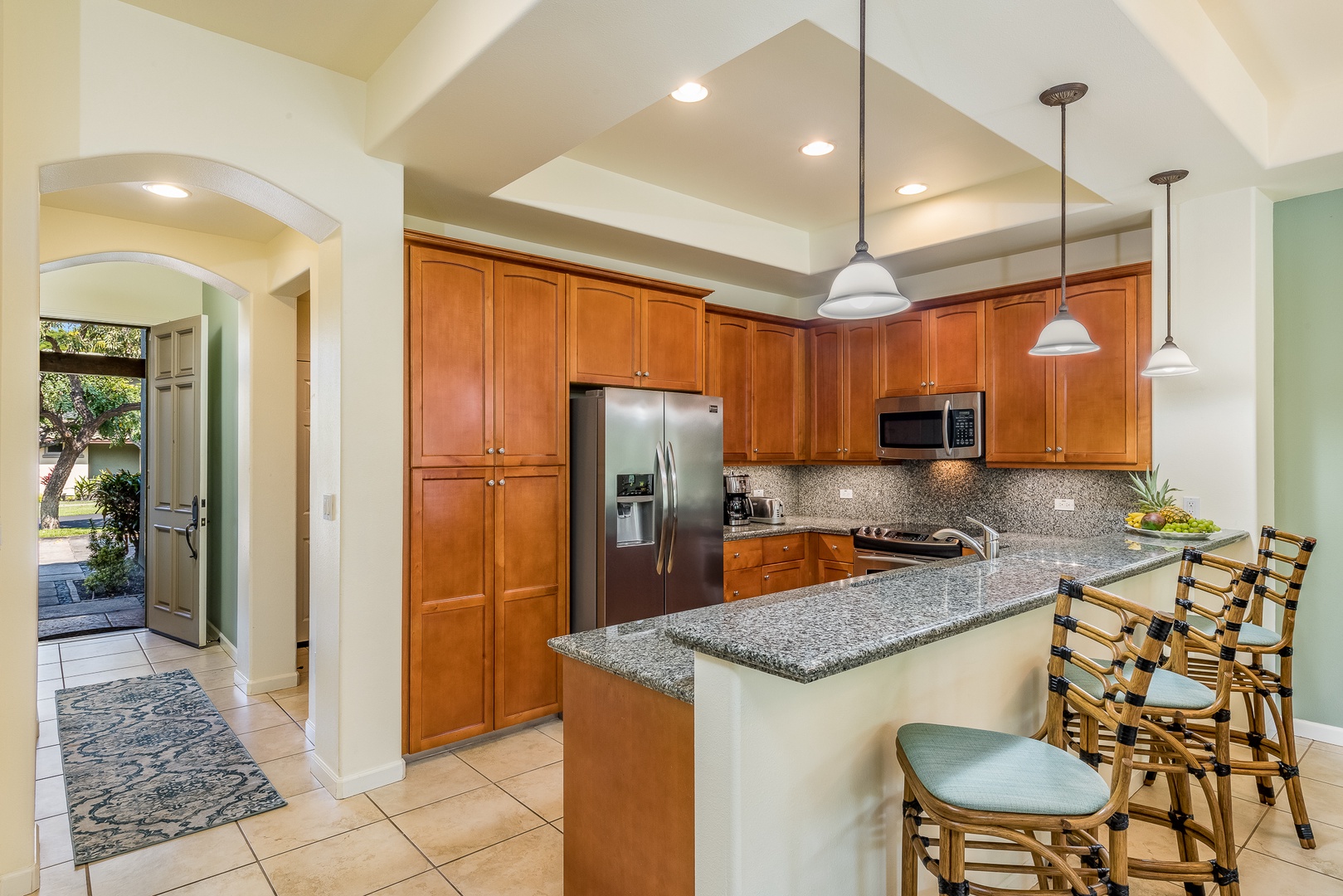 Kamuela Vacation Rentals, Mauna Lani Fairways #204 - There’s room for everyone in this beautifully designed kitchen—complete with island seating for casual meals or cocktails.